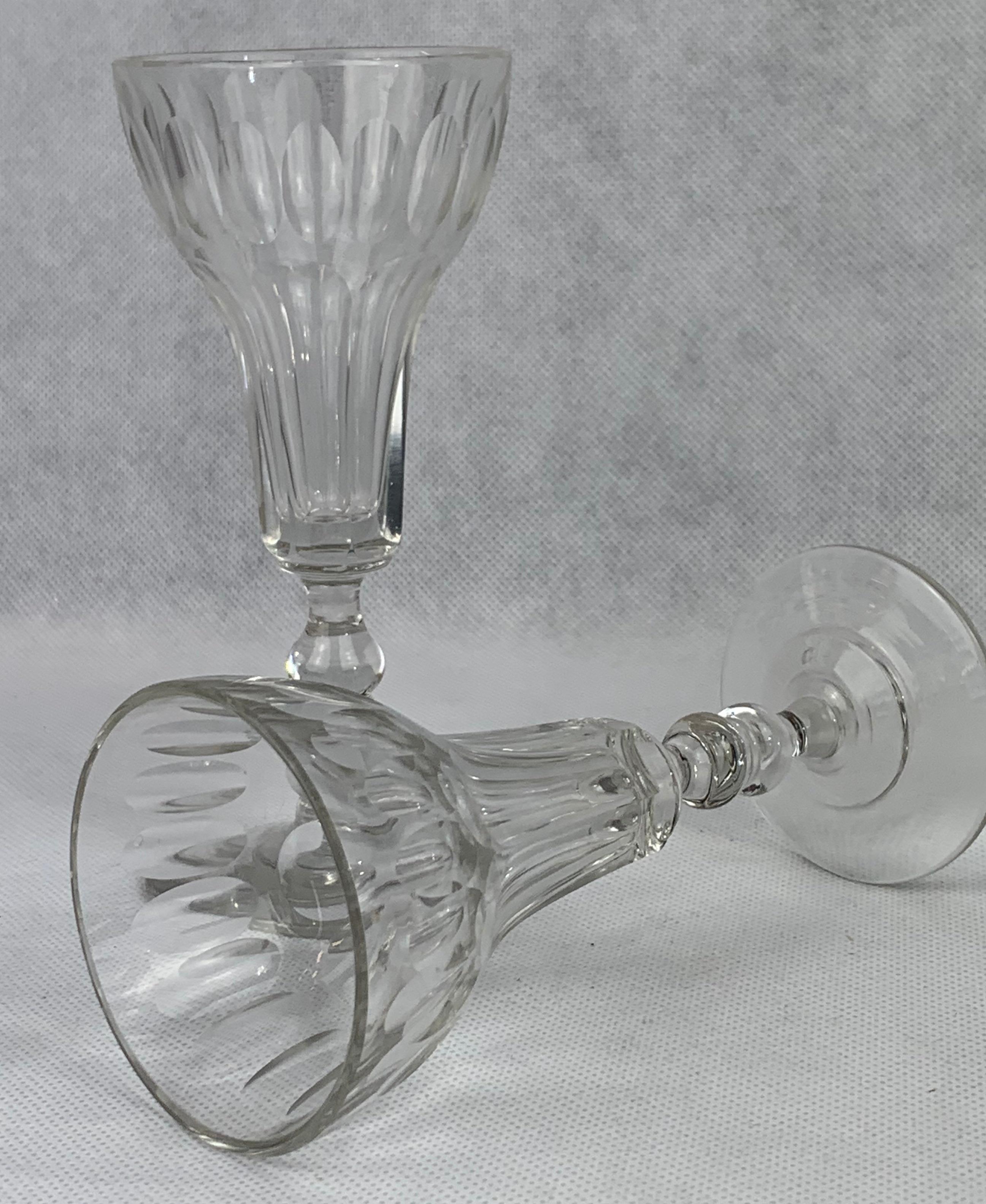 Pair of French cut crystal stemmed flutes.  The cutting style around the top is thumbprint while the body is slice cut.
This pair would service well as toasting glasses for a wedding.
H-6.5