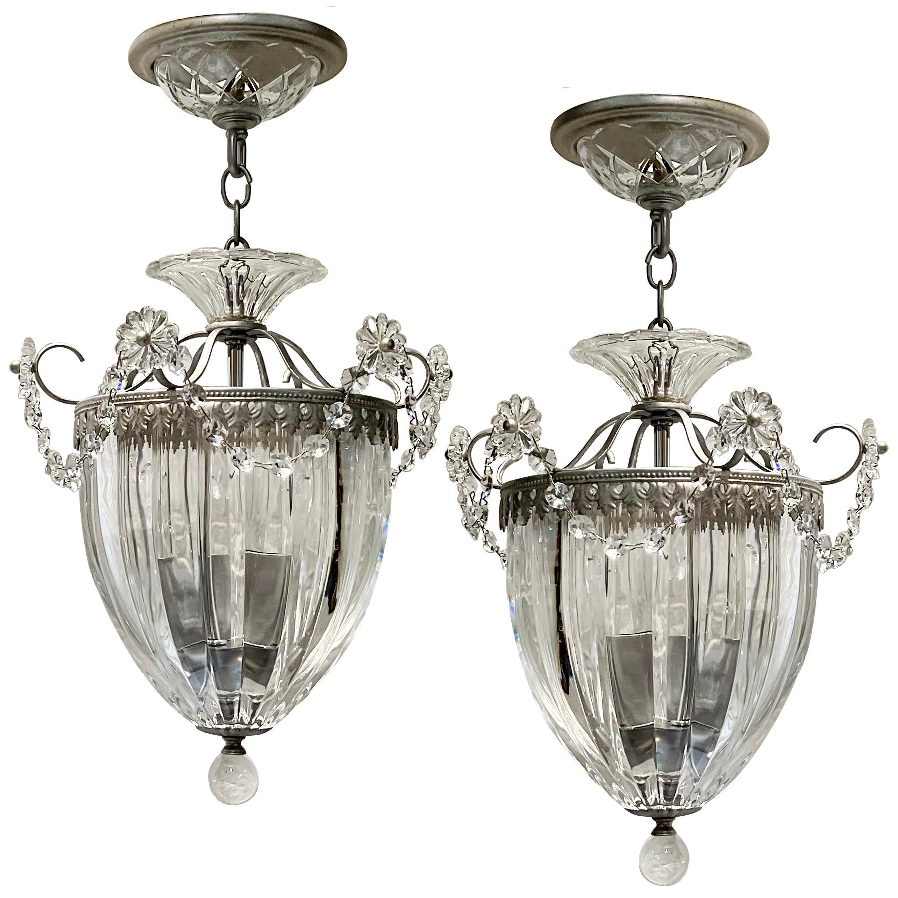 Pair of 1960's French crystal lanterns with 3 candelabra interior lights.

Measurements:
Present drop: 19