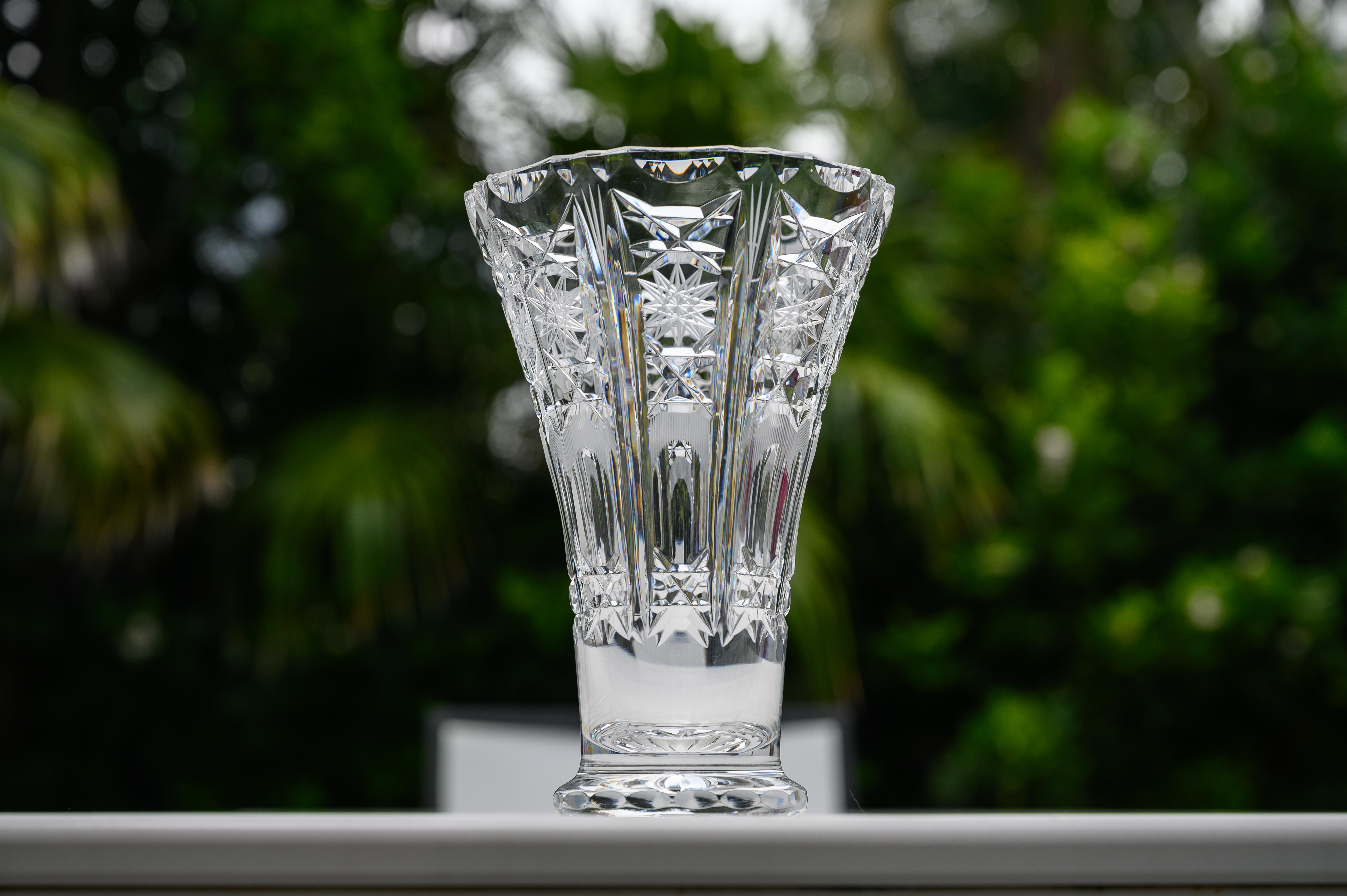 A fine pair of crystal vases attributed to Baccarat, bearing great resemblance to Klein champagne flutes, ice bucket that we recently sold. Although these beautiful flower vases are unmarked. 

Perfect condition. 
Measures: 6