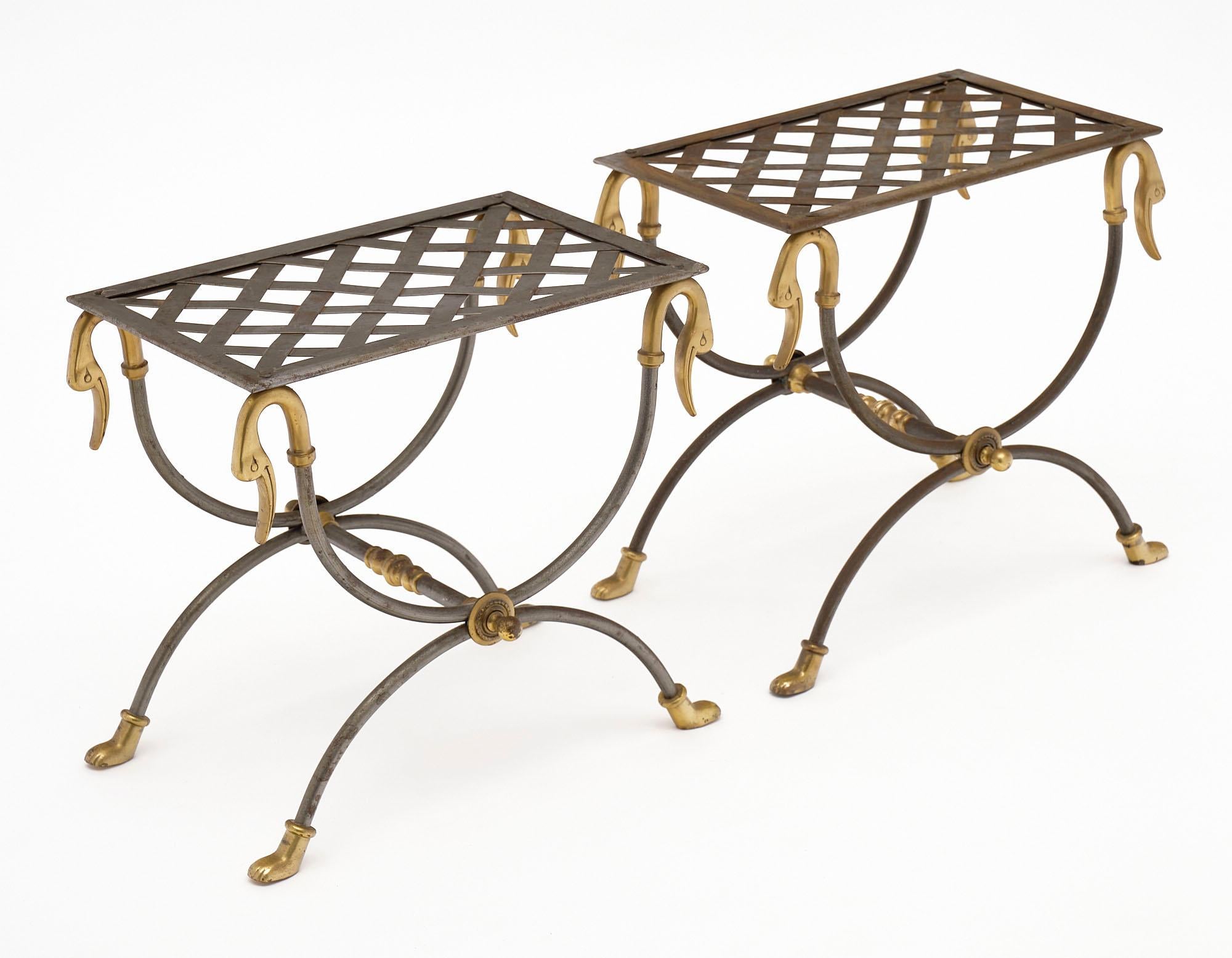 Pair of French “curule” stools made of steel and featuring solid bronze ornamentation.