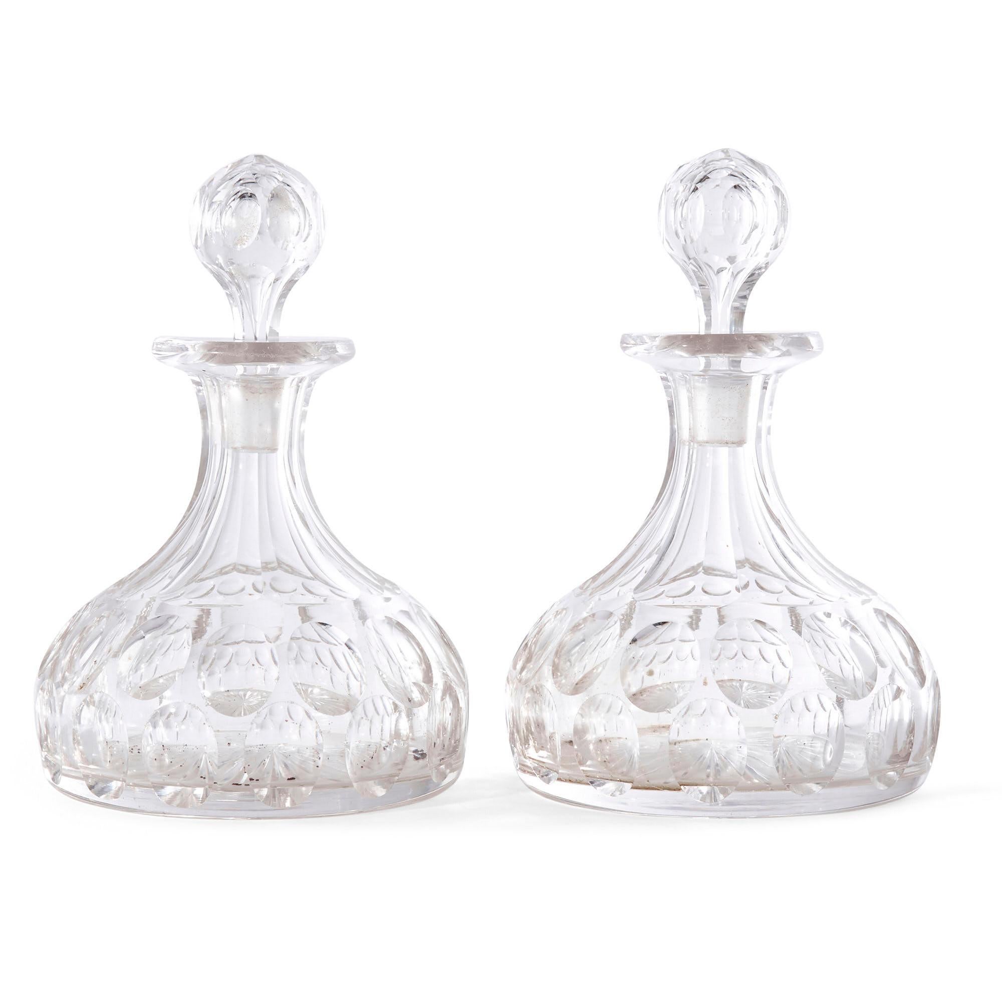 This eight-piece set comprises two cut glass ship’s decanters and eight rummer drinking glasses. The glass throughout is beautifully formed, complementing the elegant shapes of the pieces.

Measures: Decanters- Height 19cm, diameter 13cm
Glasses-