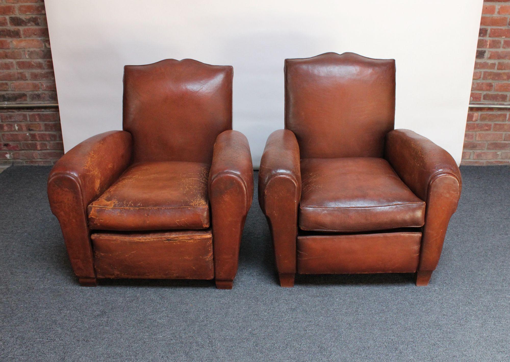Robust, handsome pair of 1930s French club chairs sourced in the south of France in supple sheep hide leather with 'mustache' back and nailhead decoration to the back border.
Presented as 'his and hers,' given the slight proportional differences
