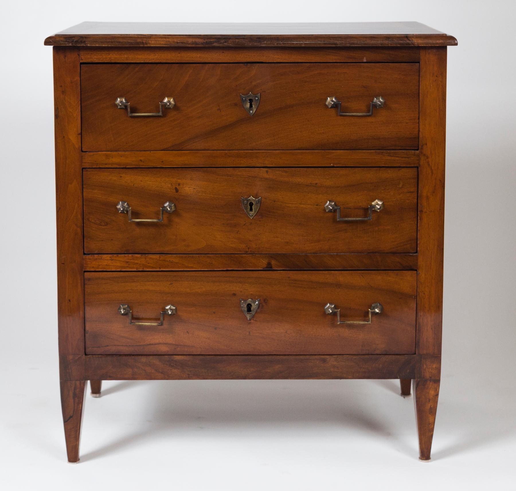 A beautiful pair of Directoire chests in solid walnut and comprised of three drawers with brass angular handles and shield-shaped escutcheons, finishing on straight, squared and tapered legs.
Dating: 1810 circa
Origin: France.
Condition: