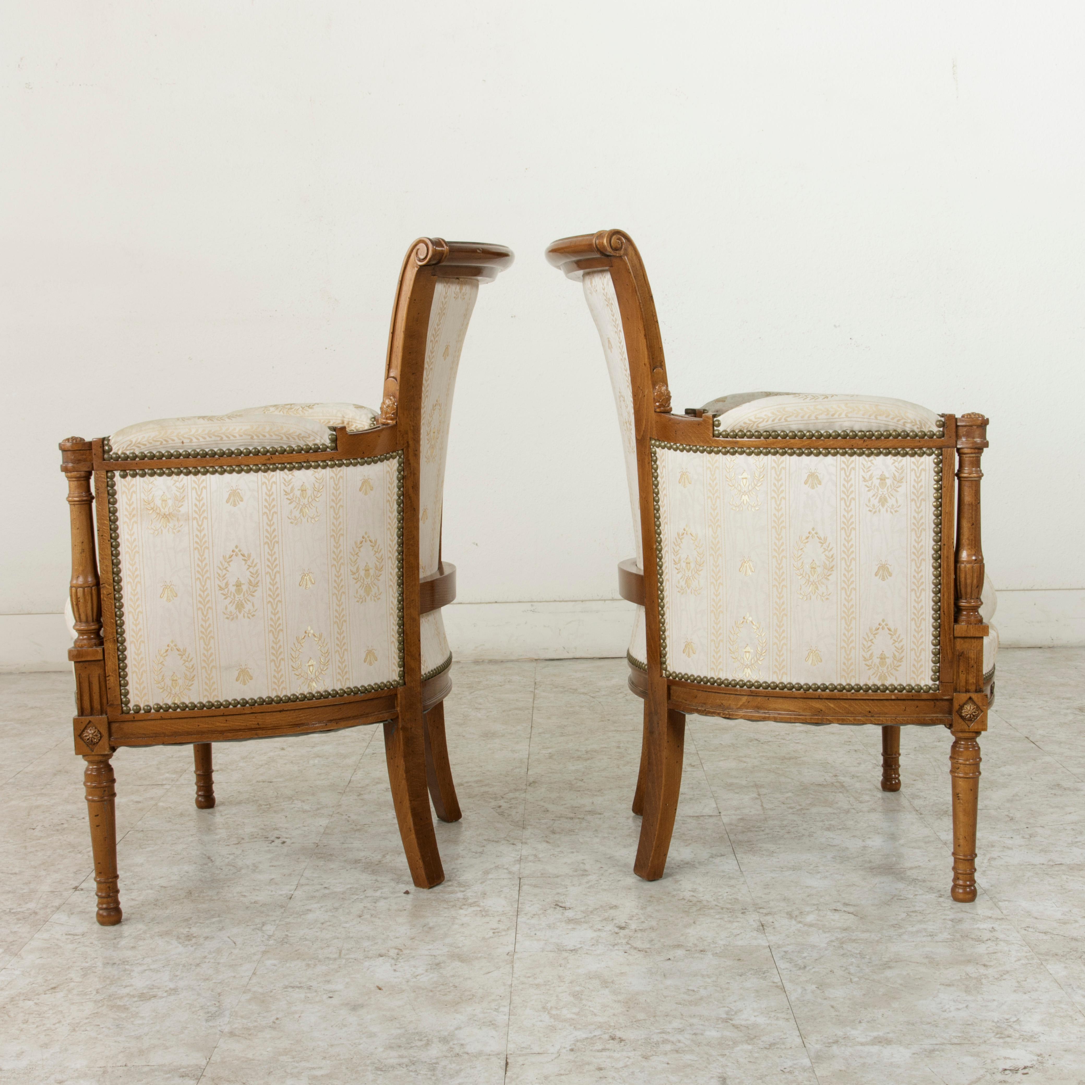 Early 20th Century Pair of French Directoire Style Walnut Bergères or Armchairs, circa 1900