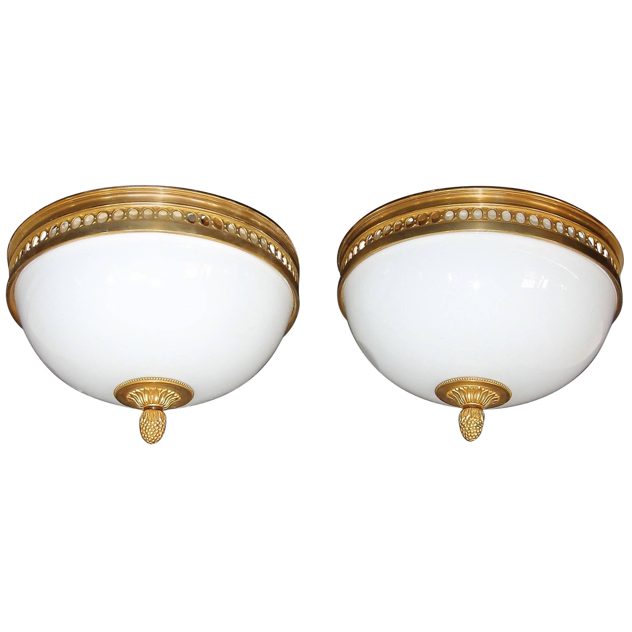 Pair of French Doré Bronze and White Opaline Glass Flush Mount Ceiling Lights
