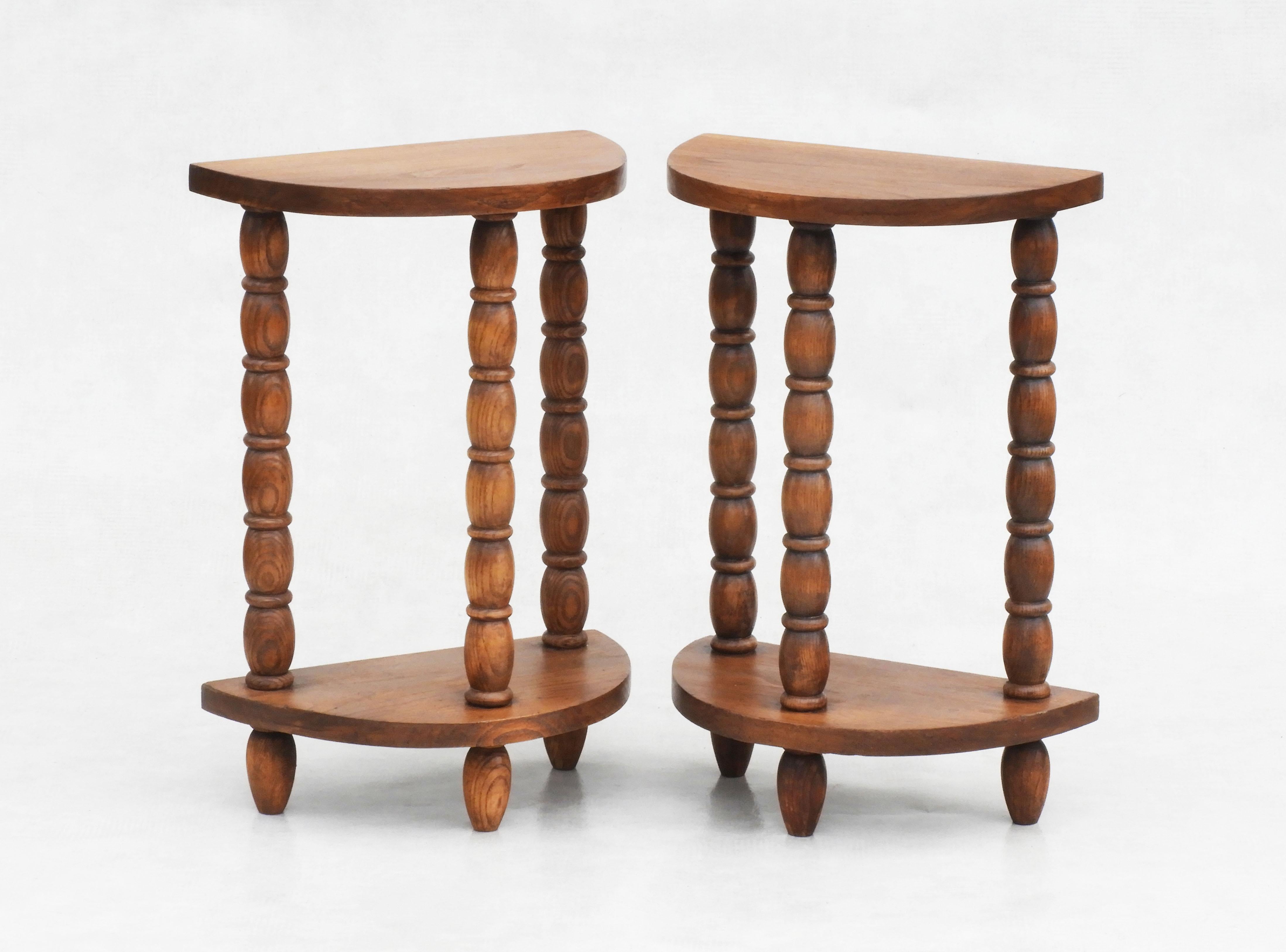 A great pair of end side tables or nightstands in the style of Charles Dudouyt C1940.   Beautifully turned golden oak, half moon tables with good grain and nice patina. These tables have a timeless quality that lets them sit easily within a wide