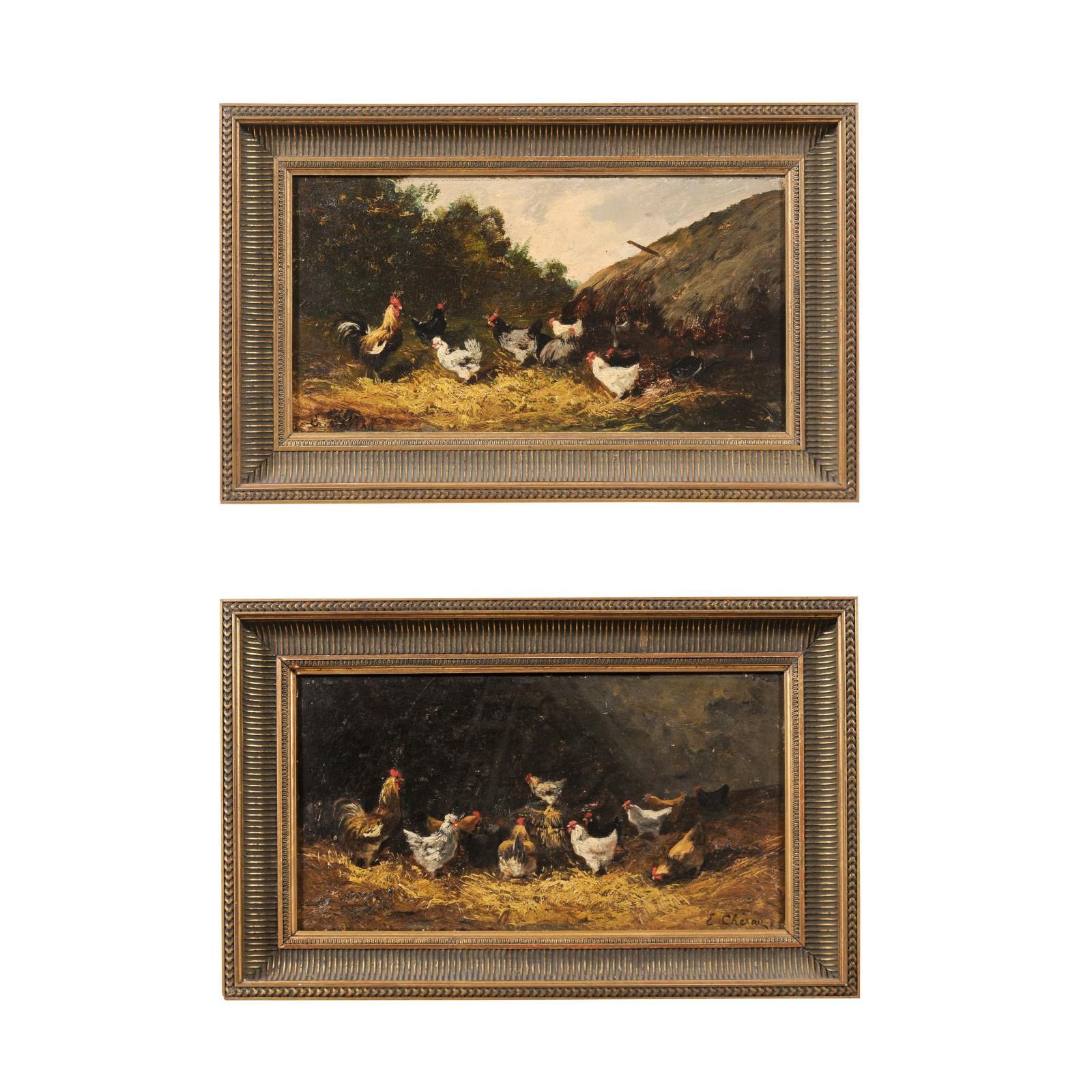 A pair of French framed oil on board paintings from the early 20th century, depicting chickens. Created in France during the early years of the 20th century, each of this pair of paintings depicts a farm scene dominated by the presence of a rooster