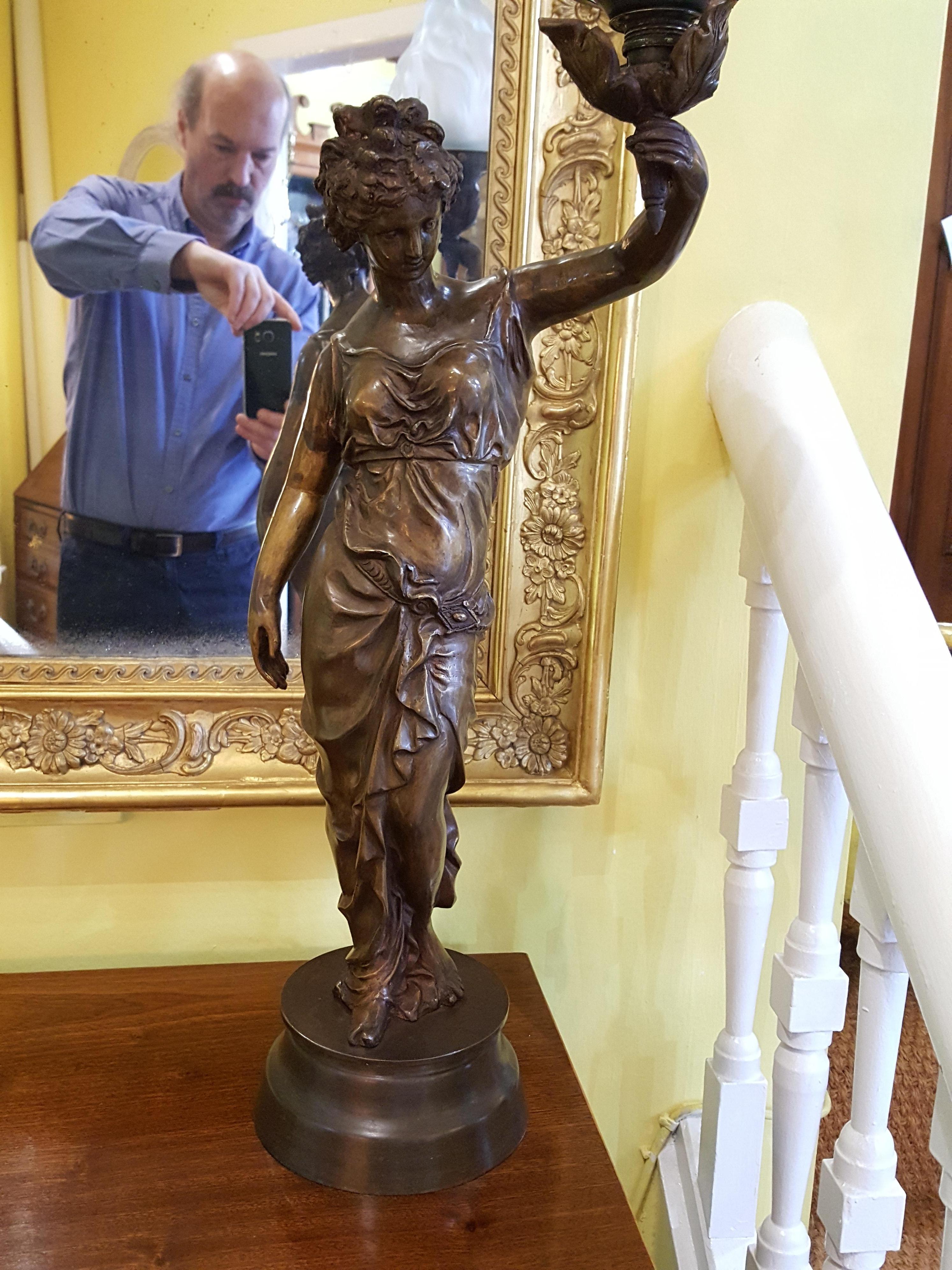 Pair of French early 20th century bronze figural table lamps in the form of 2 maidens each holding a torch 12