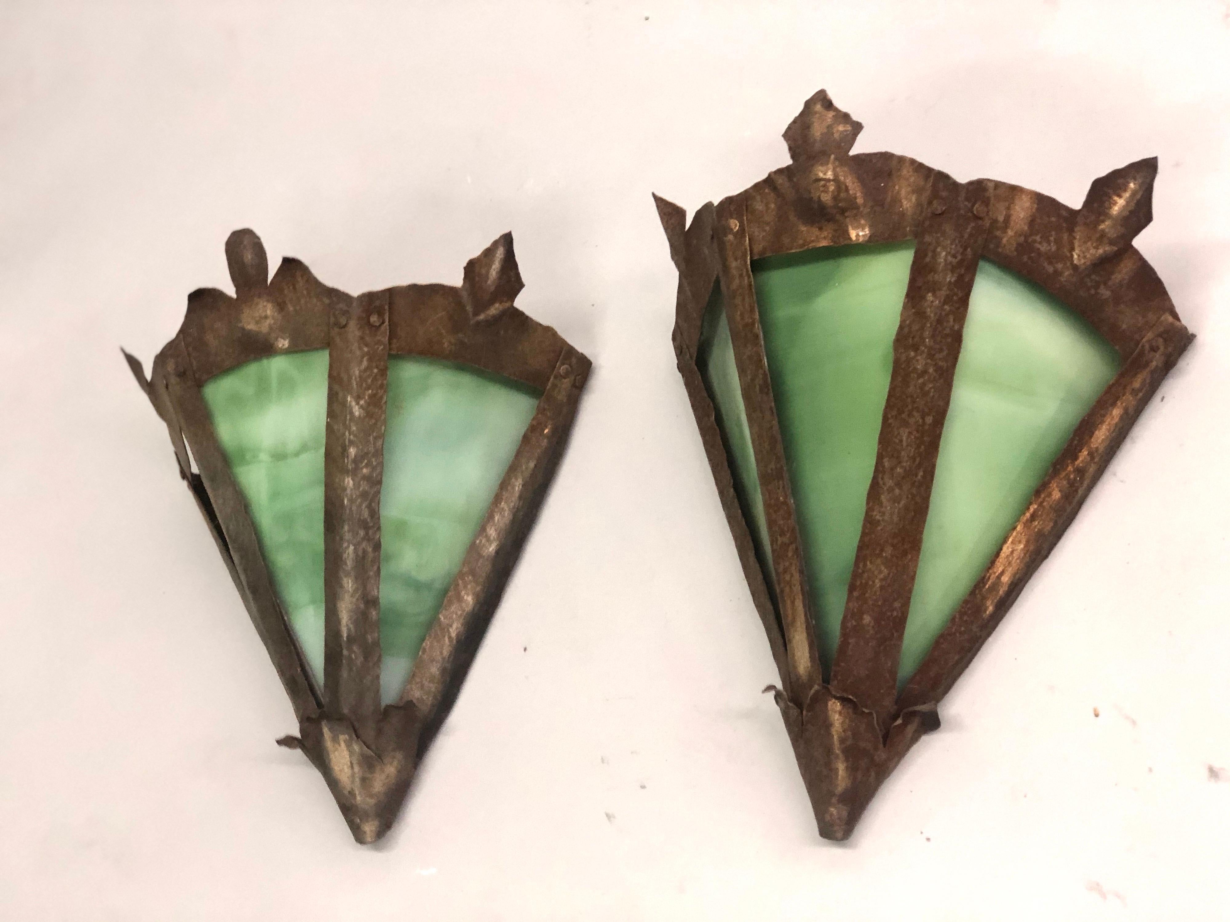 A pair of French early 20th century handmade rustic leaded glass wall lights with three opaque green glass panels set in a tin frame.