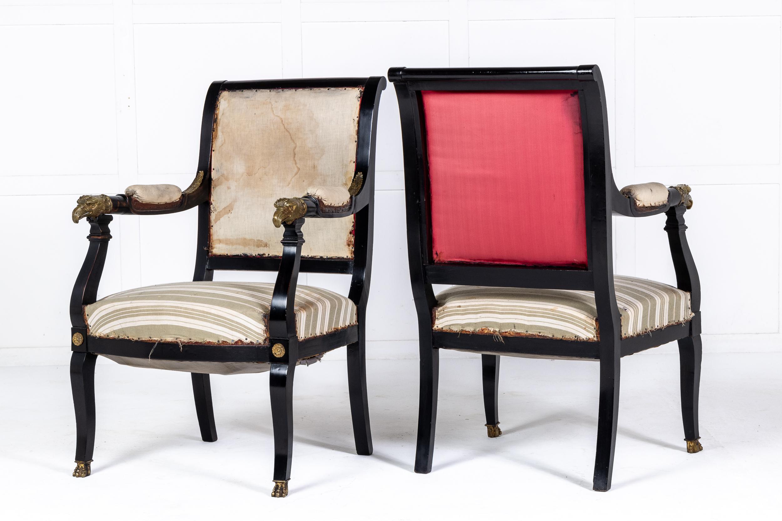A pair of French Empire style ebonised armchairs with fine eagle head mounts.

These fine armchairs, in the early 19th century Empire style, were made in France c.1910. The ebonised finish contrasts beautifully with the fine ormolu mounts, including