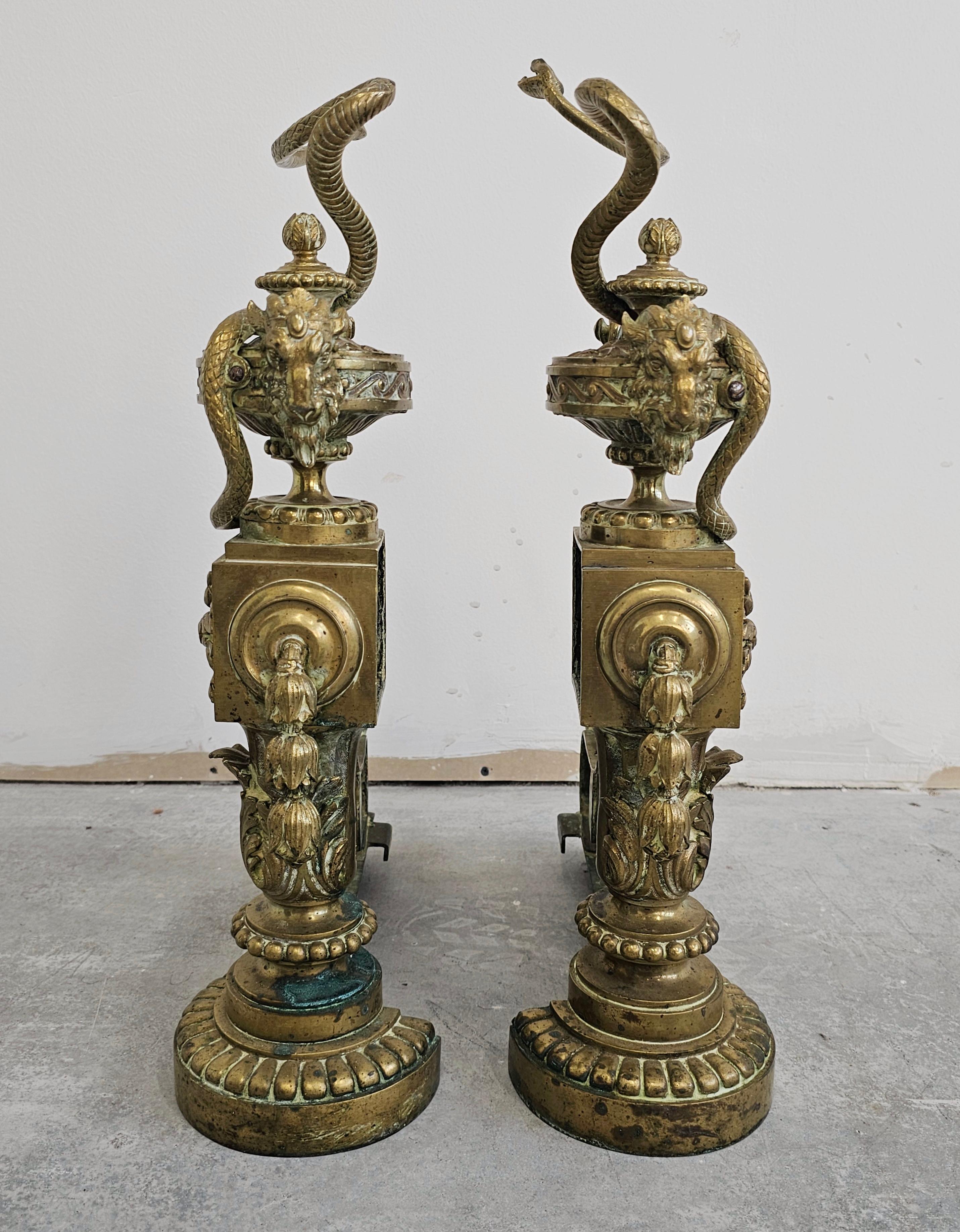 Pair of French Empire Andirons done in gilt brass, featuring snakes and ram head For Sale 5