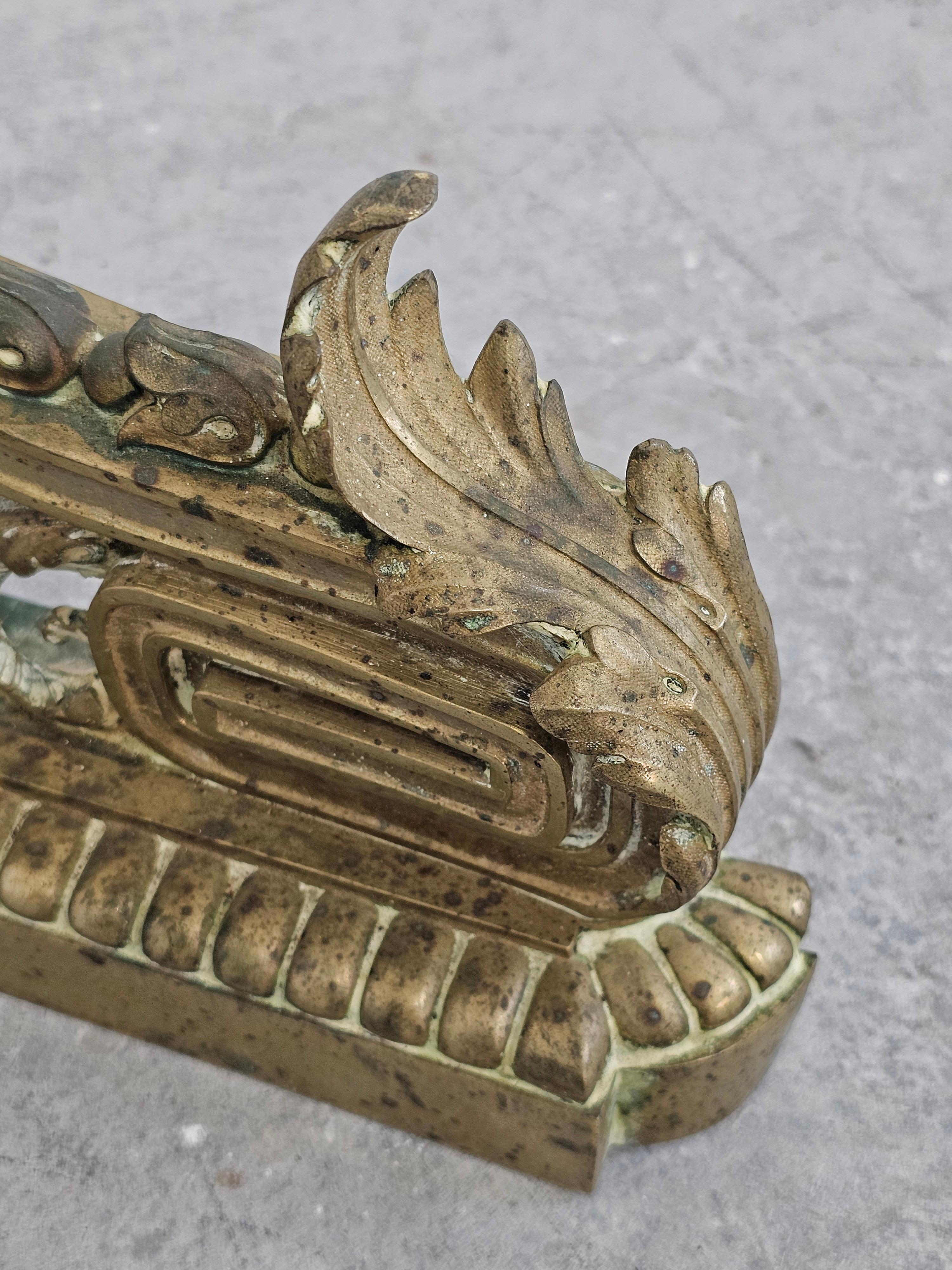Pair of French Empire Andirons done in gilt brass, featuring snakes and ram head For Sale 1