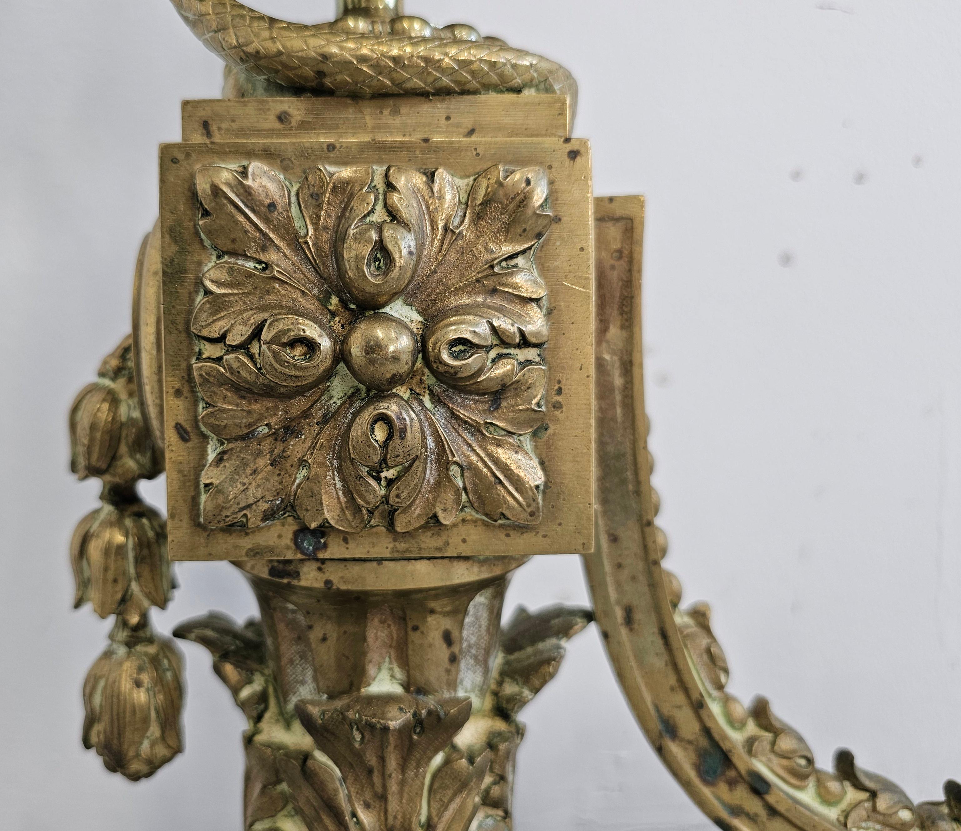 Pair of French Empire Andirons done in gilt brass, featuring snakes and ram head For Sale 2