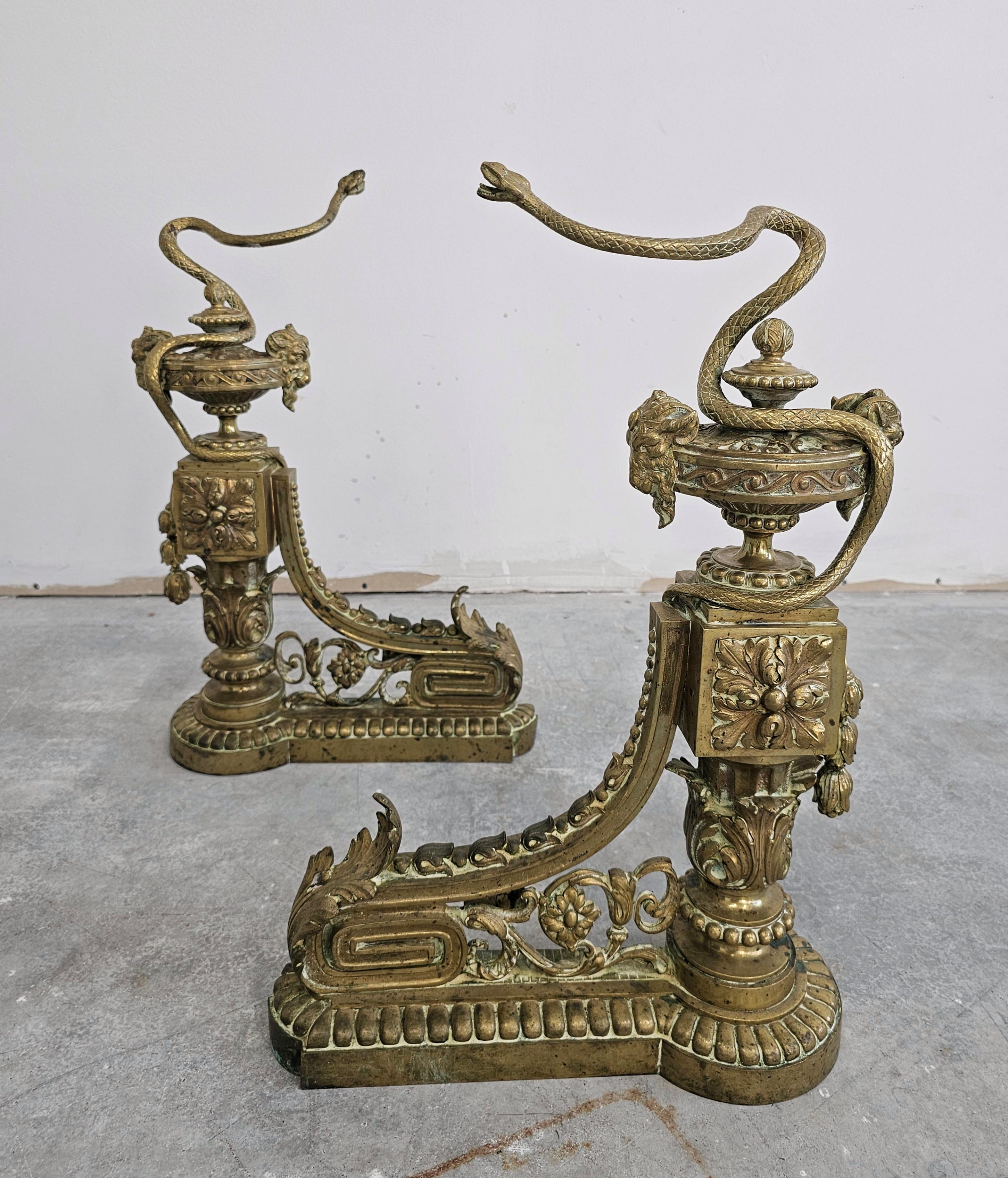 Pair of French Empire Andirons done in gilt brass, featuring snakes and ram head For Sale 3