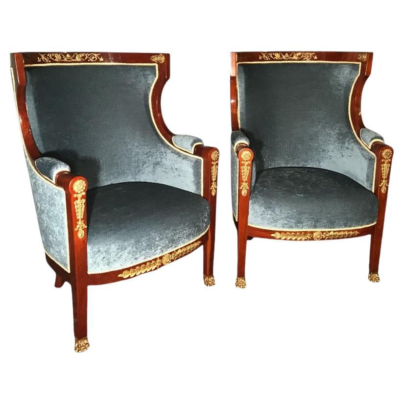 Pair of French Empire Barrel Armchairs, 19th century
This beautiful pair of French Empire barrel armchairs dates back to the 19th century and combines elegance with exceptional craftsmanship. Made from rich mahogany wood, they feature intricate