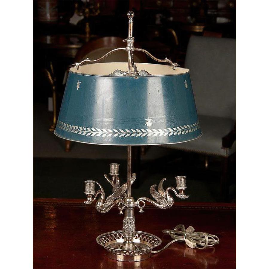 A pair of French Empire style silvered three lite swan arm Bouillotte lamps with stenciled shades and openwork basket bases.