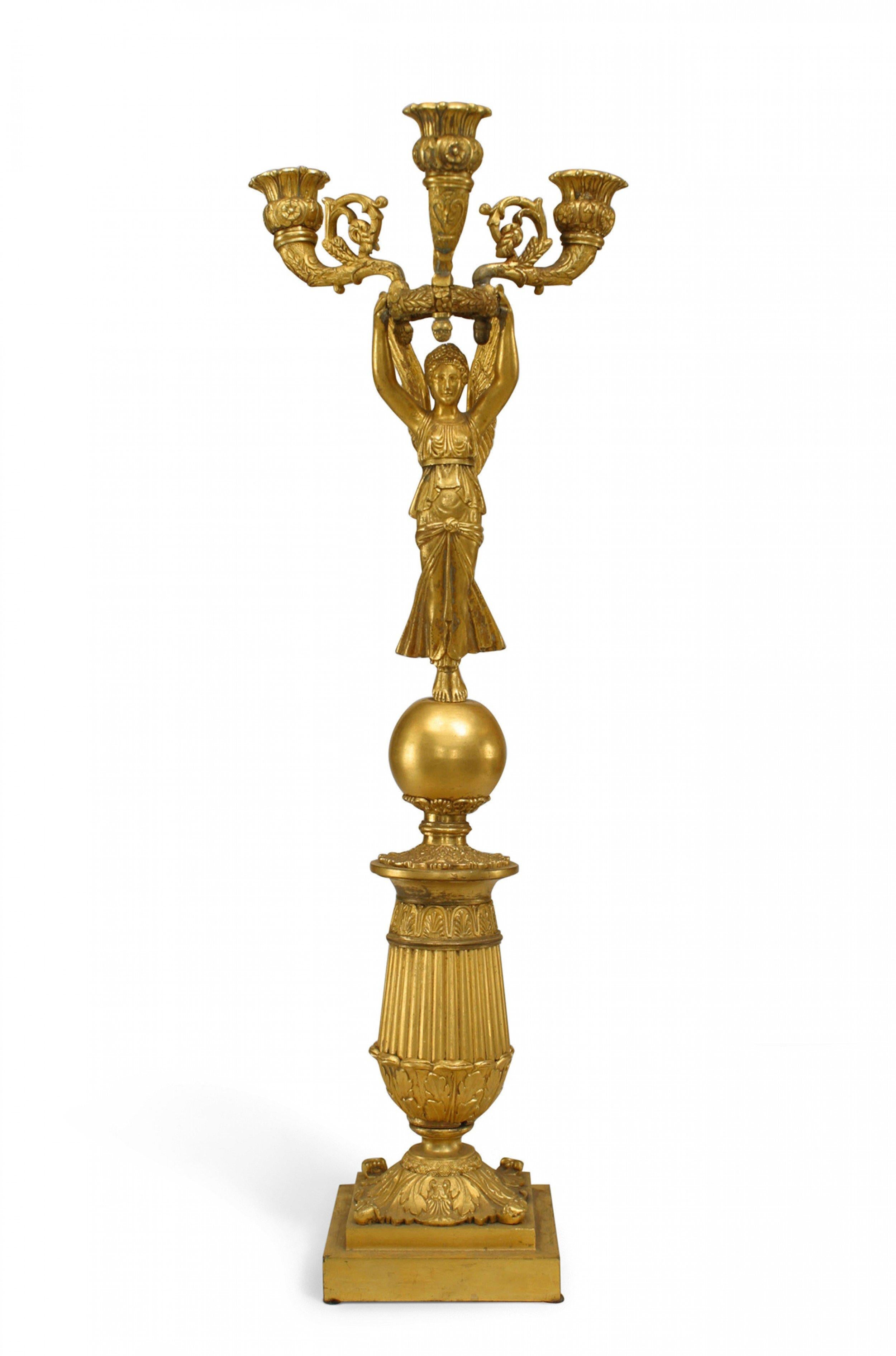 Pair of French Empire-style (19th Century) bronze dore 3 arm candelabras supported by winged figures (PRICED AS PAIR).
 