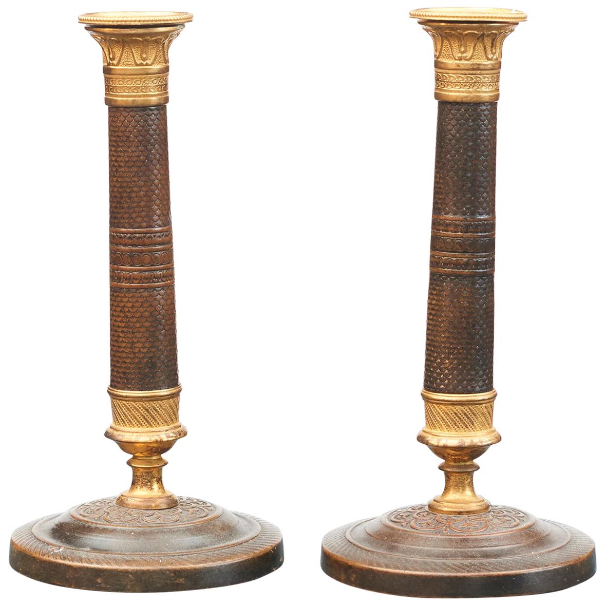 Pair of French Empire Candlesticks in Gilt and Burnished Bronze
