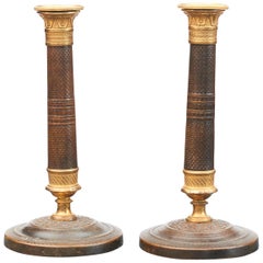 Pair of French Empire Candlesticks in Gilt and Burnished Bronze