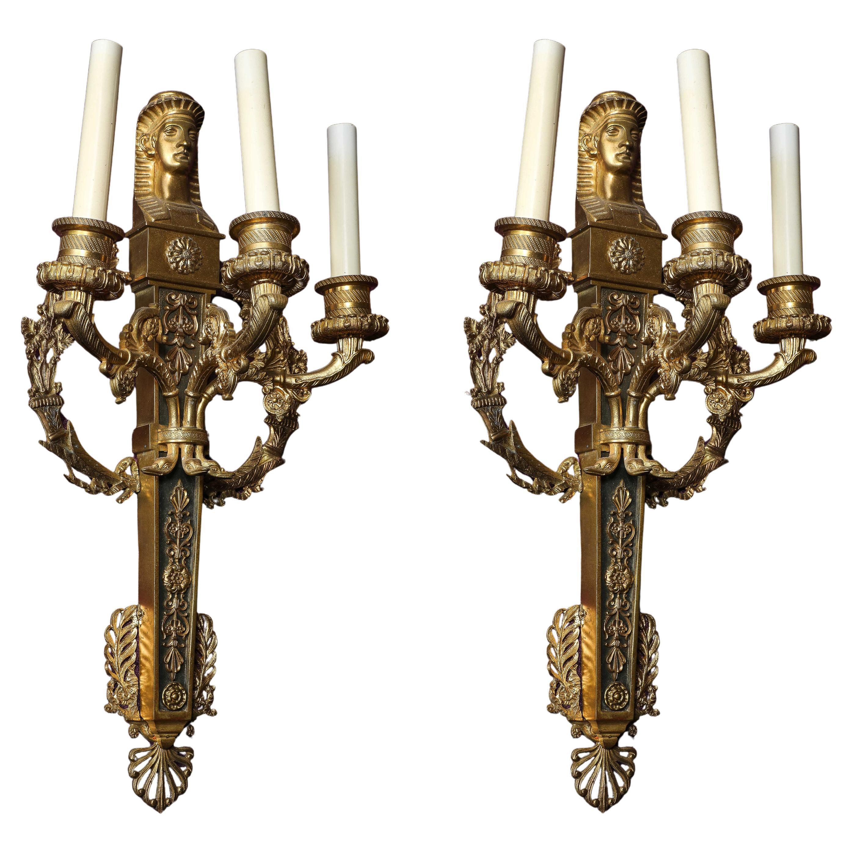 Pair of French Empire Dore 
Patinated Bronze Egyptian Revival 3-Light Sconces
