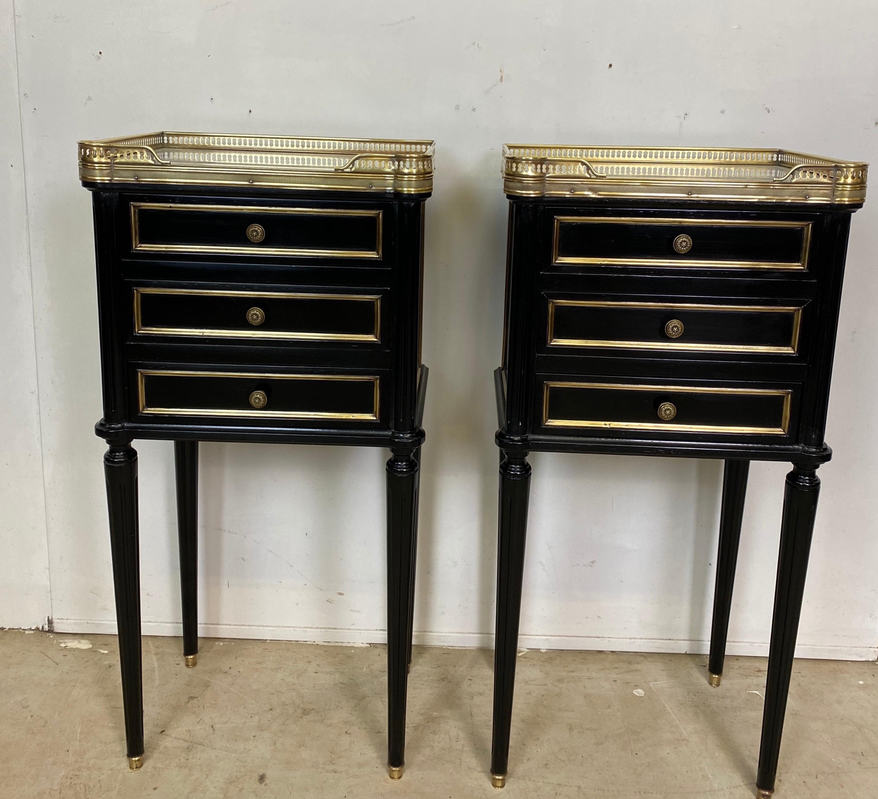 A nicely proportioned pair of French Empire ebonized nightstands. All in excellent condition.