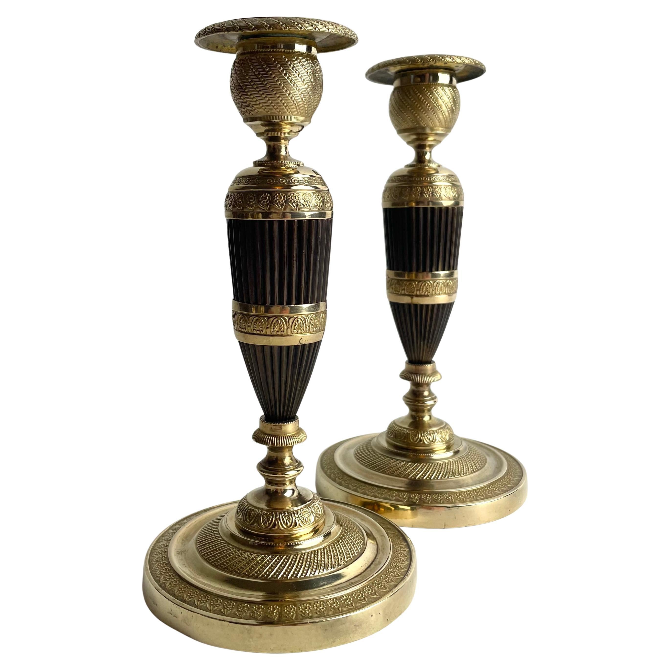 Pair of French Empire Gilt and Patinated Bronze Candlesticks, 1820s For Sale
