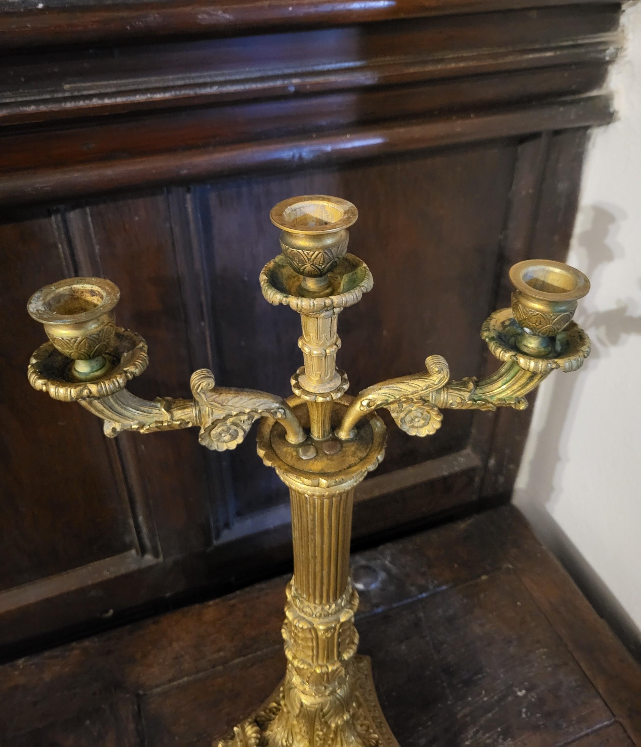 Gilt Pair of French Empire gilt bronze candelabra  For Sale