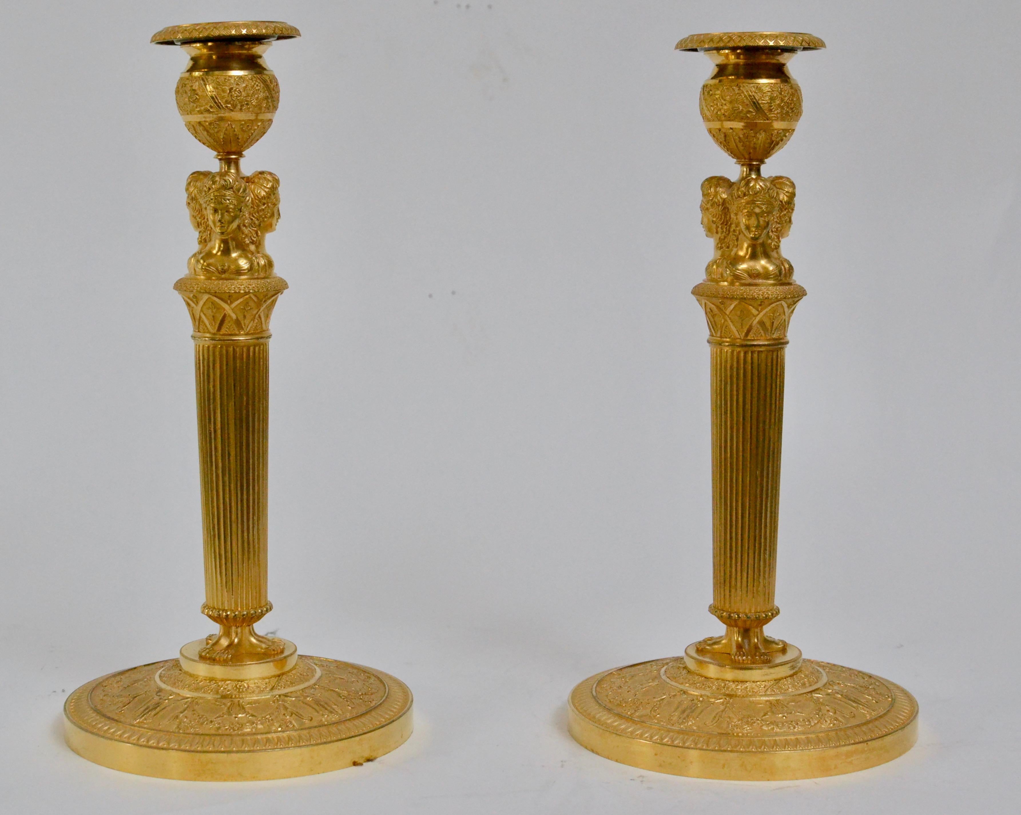 A fine pair of early French Empire gilt bronze candlesticks, circa 1810.