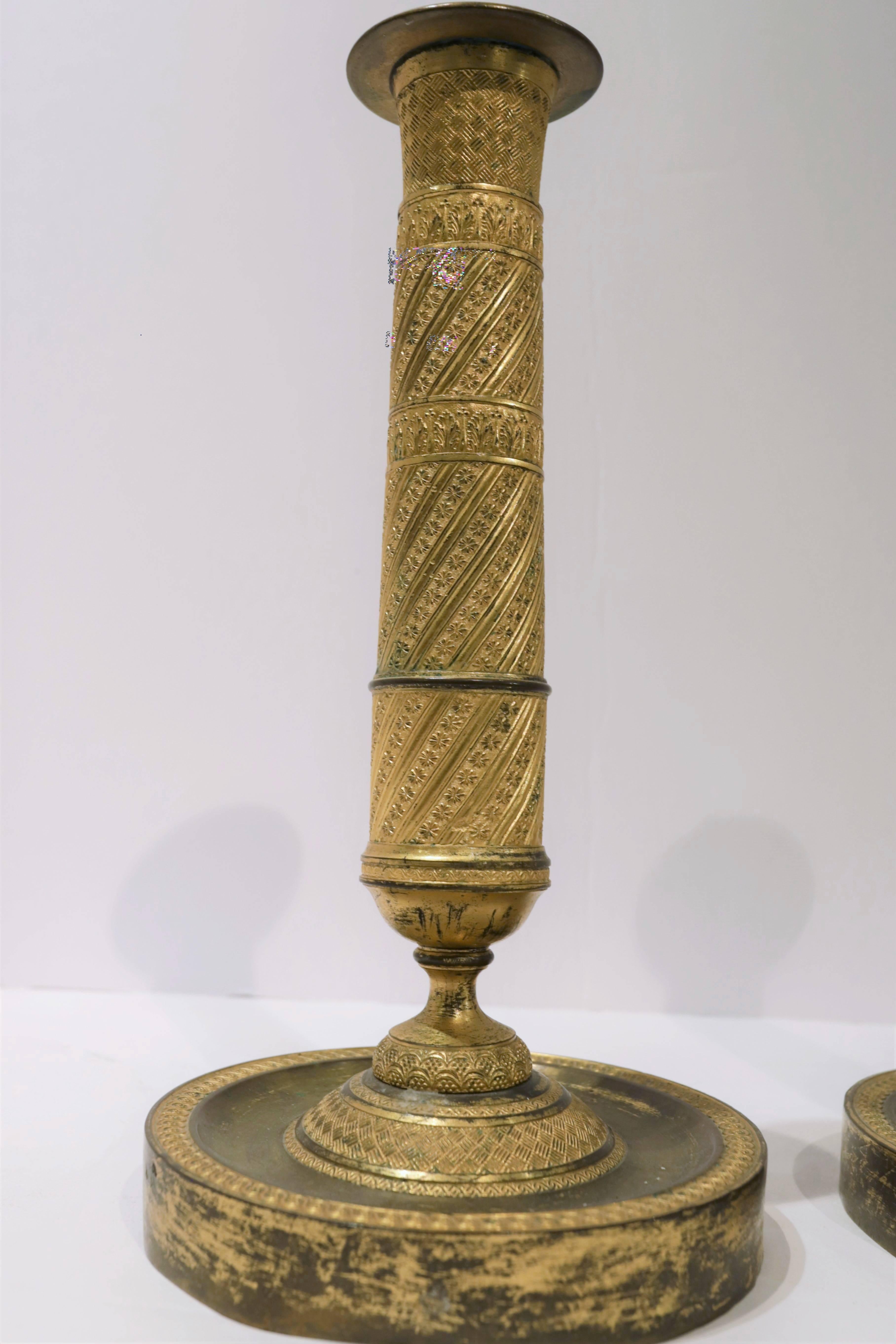 Pair of early 19th century French Empire gilt bronze candlesticks.