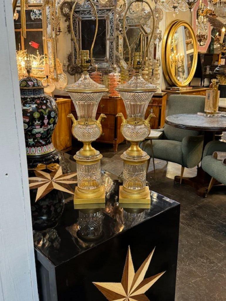 Fine pair of 19th century French Empire gilt bronze and crystal urns mounted as lamps. Circa 1890. A fine addition to any home! 20H x 7W