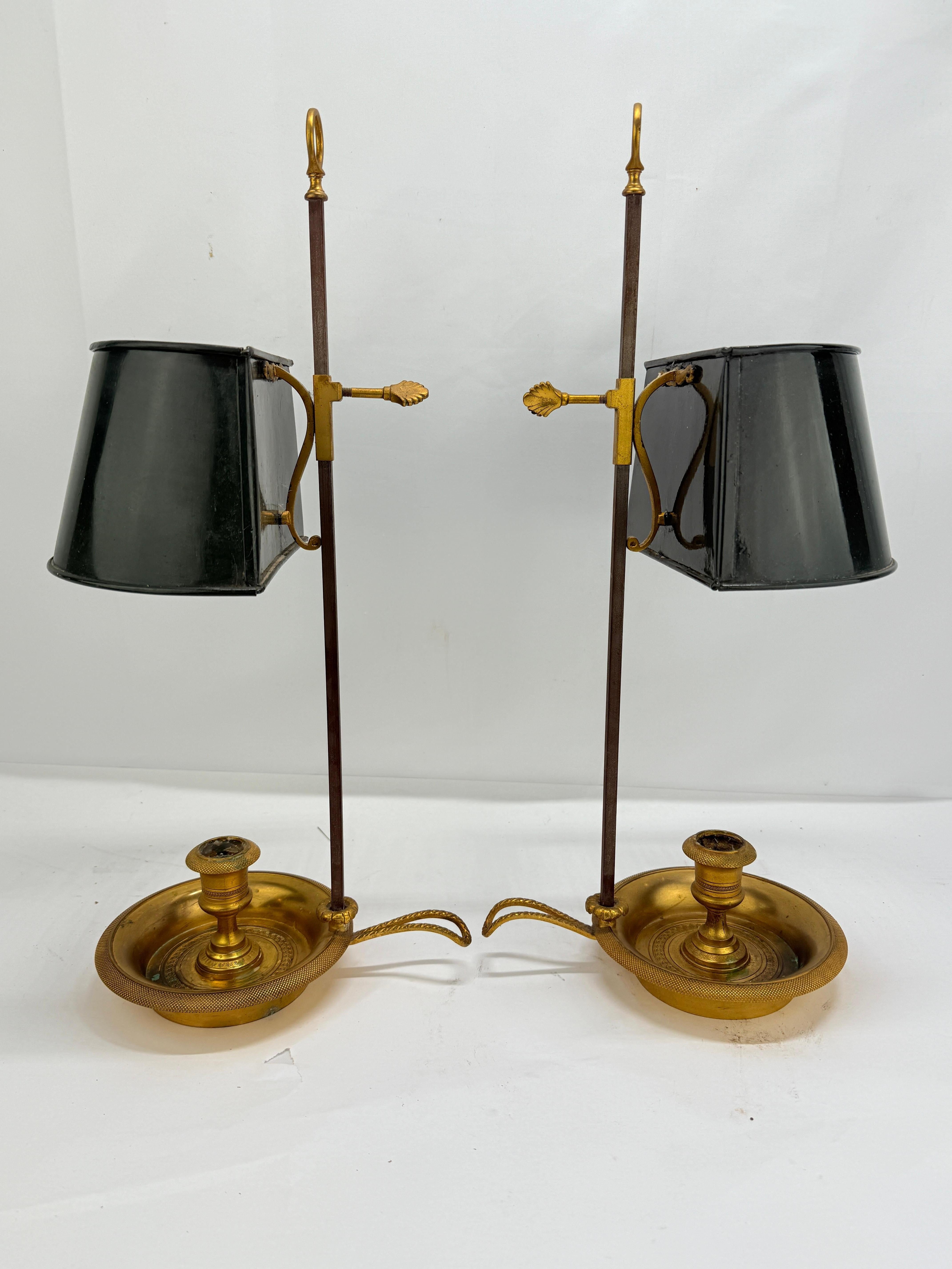 ****Can be wired if requested. Please contact first. ****

A handsome pair of French Empire-style bouillotte candlesticks, each composed of richly fire-gilded bronze with its original black tole shade riding on an adjustable standard. The circular