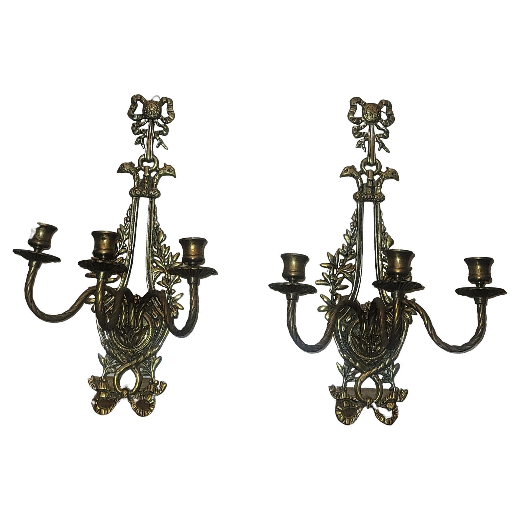 A beautiful pair of Louis XVI style 3 arms wall candle sconces measuring 17.75