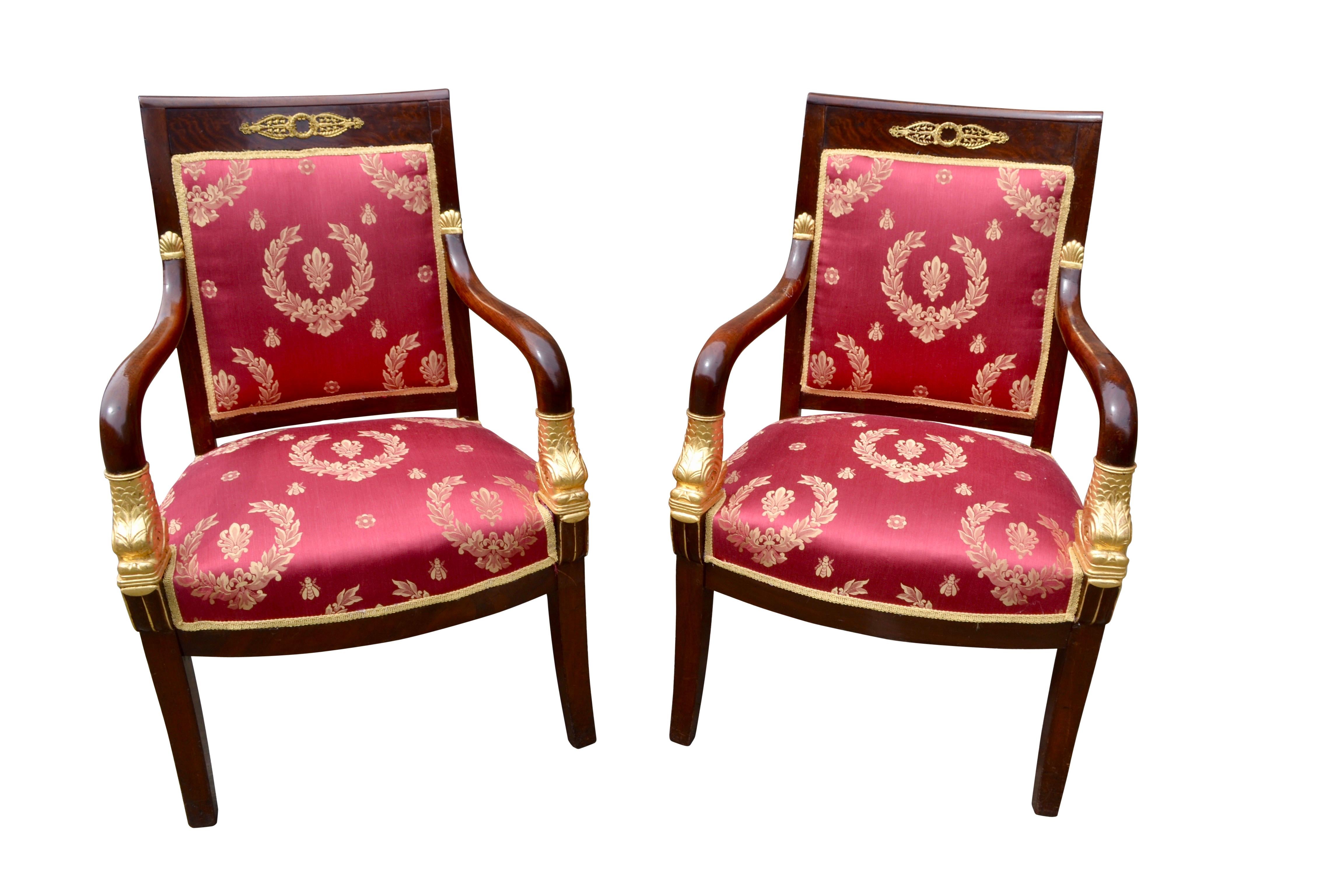 Hand-Crafted Pair of French Empire Mahogany Armchairs Accented by Gilded Dolphin Heads