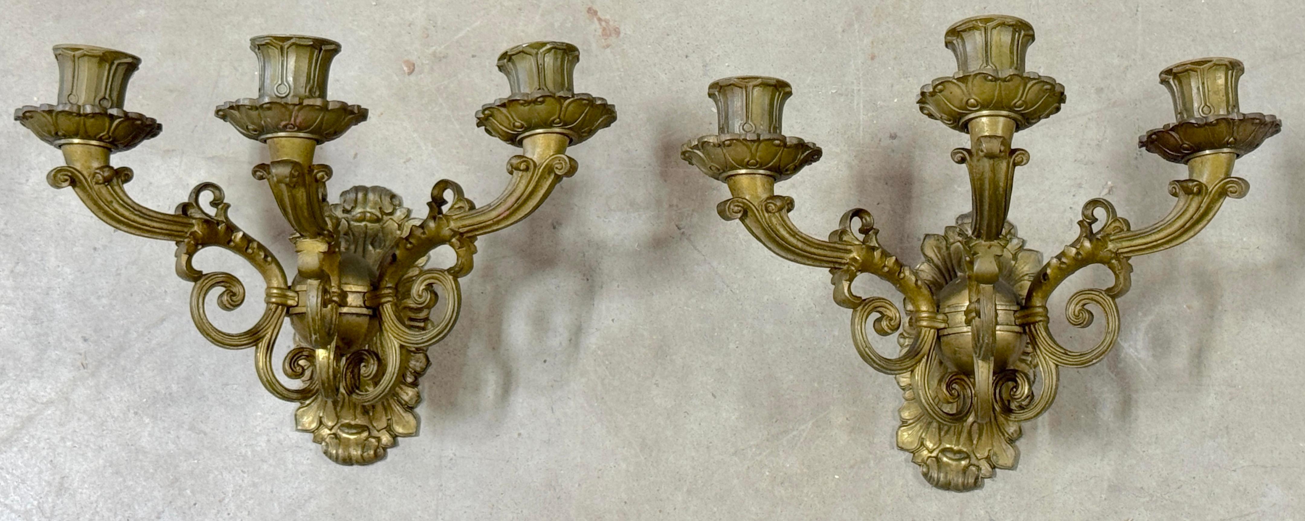 Pair of French Empire Orb Bronze Three-Light Wall Sconces 

France, Early 19th Century

This exquisite pair of French Empire wall sconces embodies the elegance and workmanship of the early 19th century. Featuring a striking horizontal design, each
