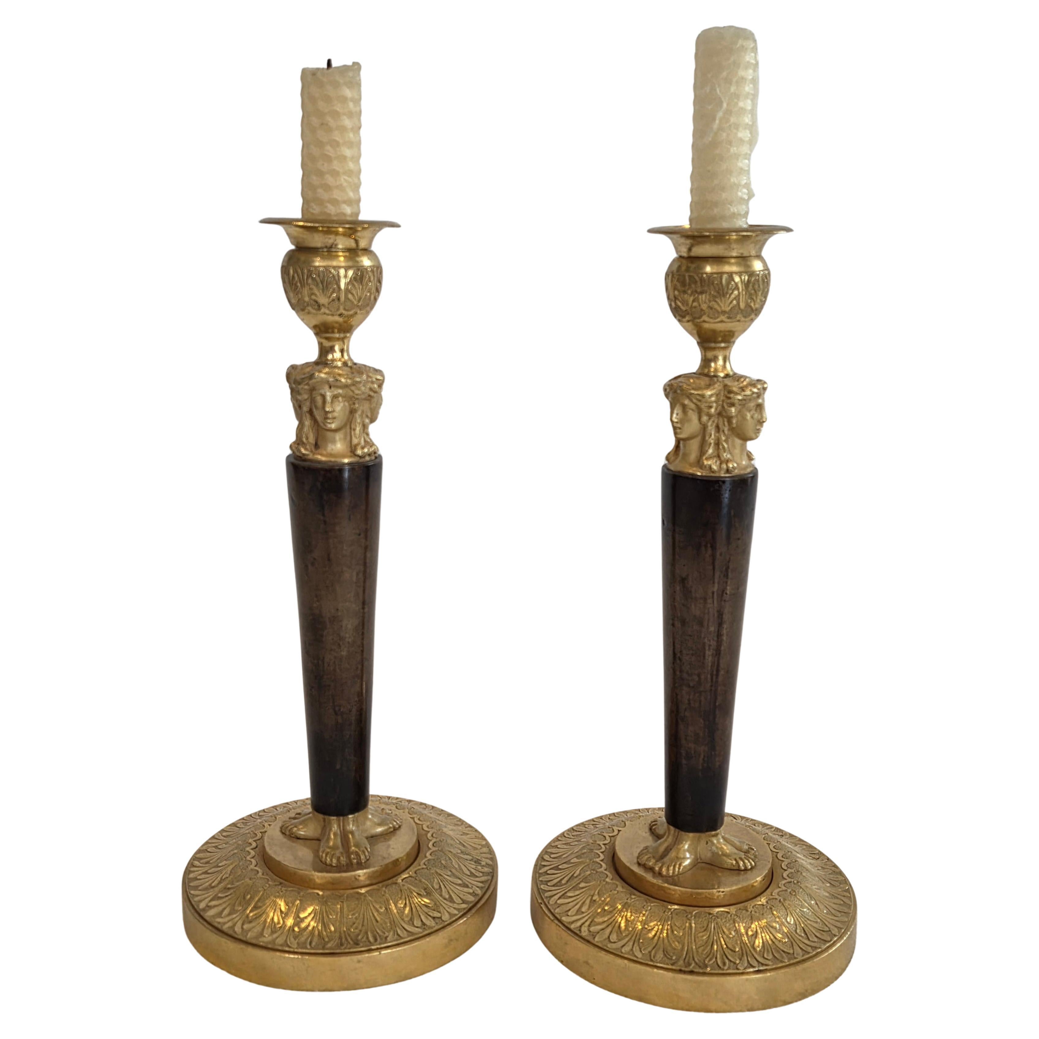 Pair of French Empire Period Fire-Gilt Ormolu and Patinated Bronze Candlesticks
