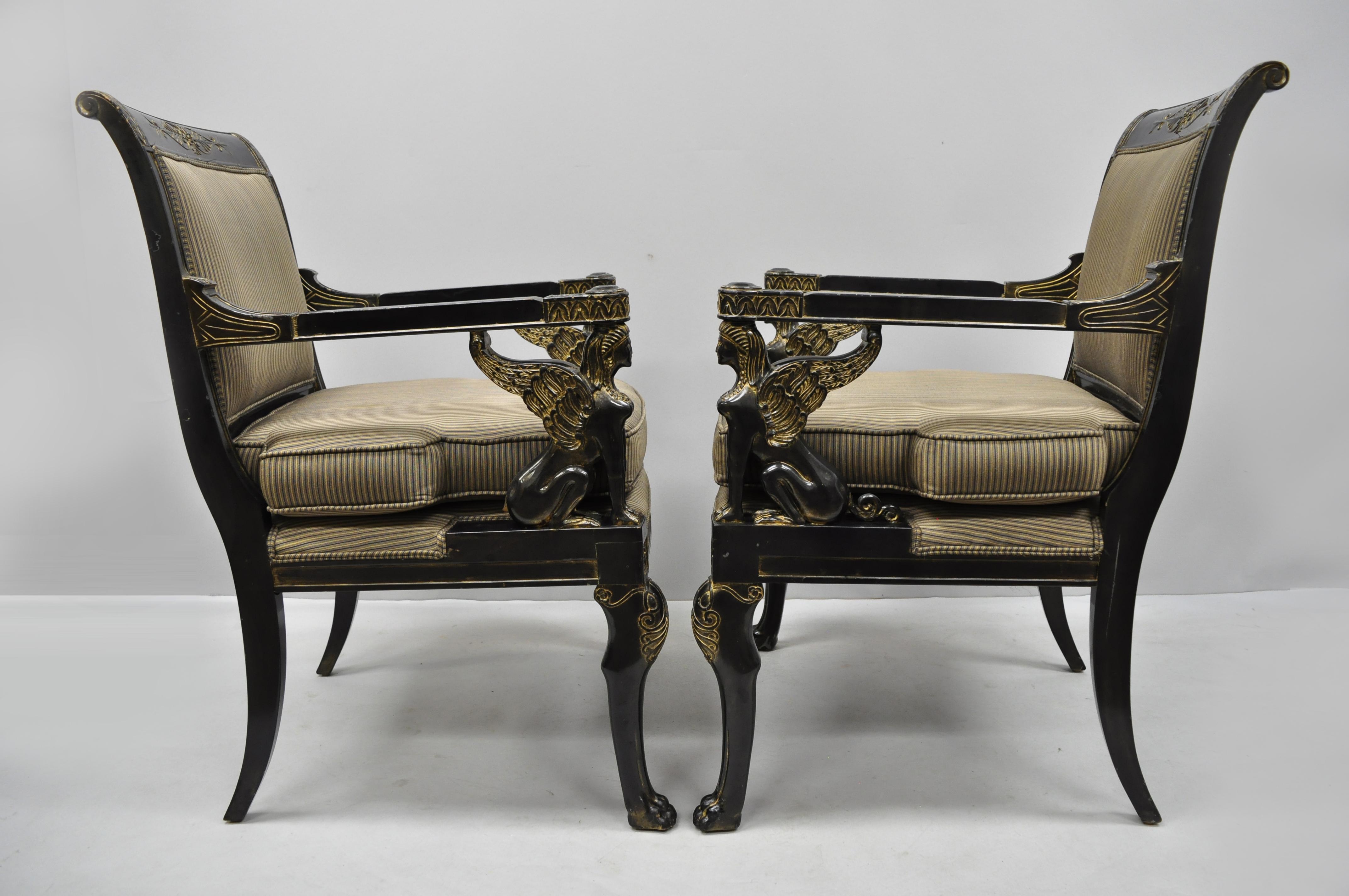 Pair of French Empire Regency style black lacquer chairs with Sphinx figures by Lambert. Items feature carved sphinx figures, paw feet, black lacquer finish, gold accents, solid wood construction, nicely carved details, original label and great