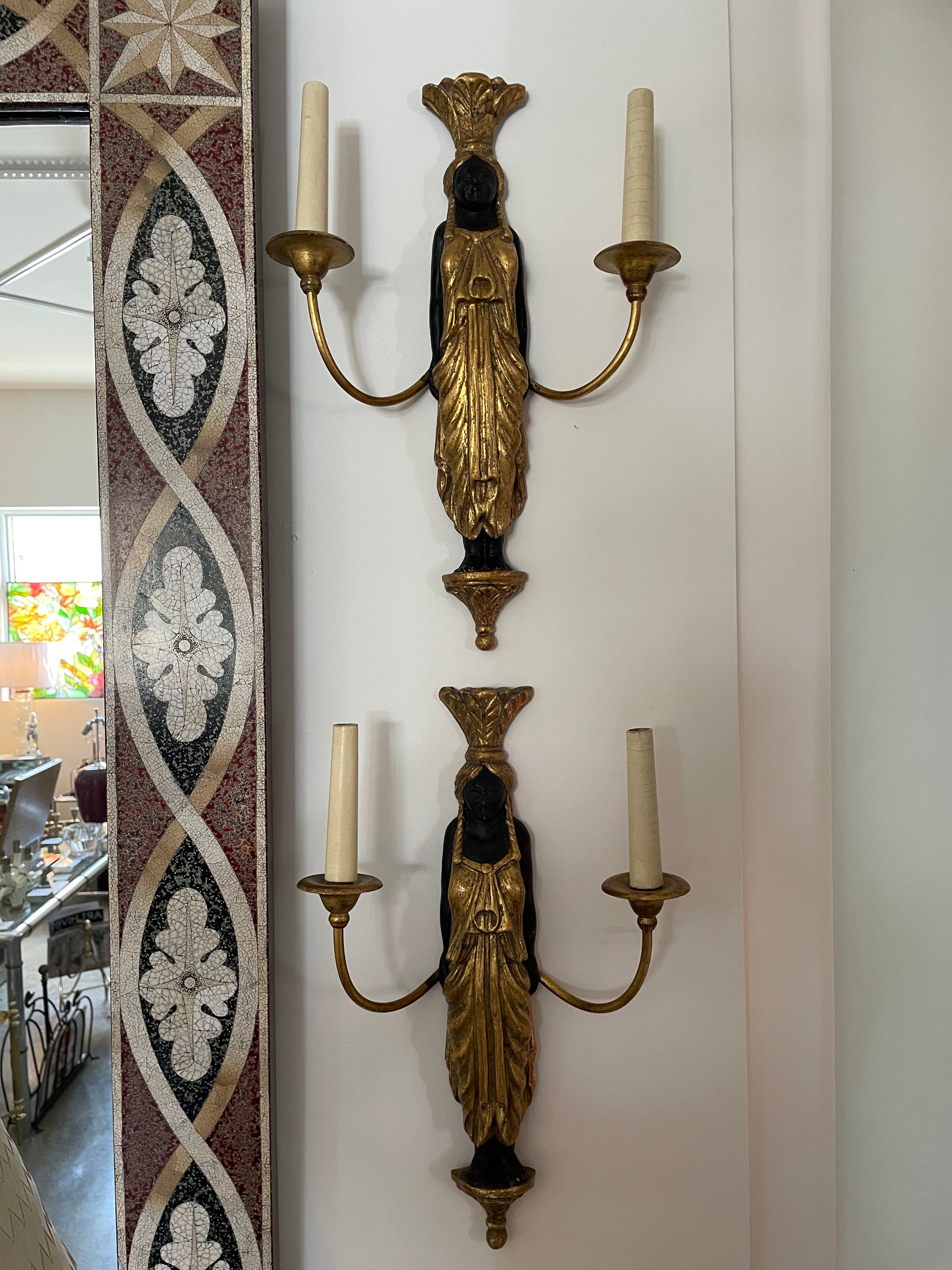 This stylish and chic of Napoleon III wall sconces were acquired in Belgium., and they will make a dramatic stament with their form and finishes.  The pieces have been professionally rewired. 

Note: Require Candleabra Based Bulbs.
