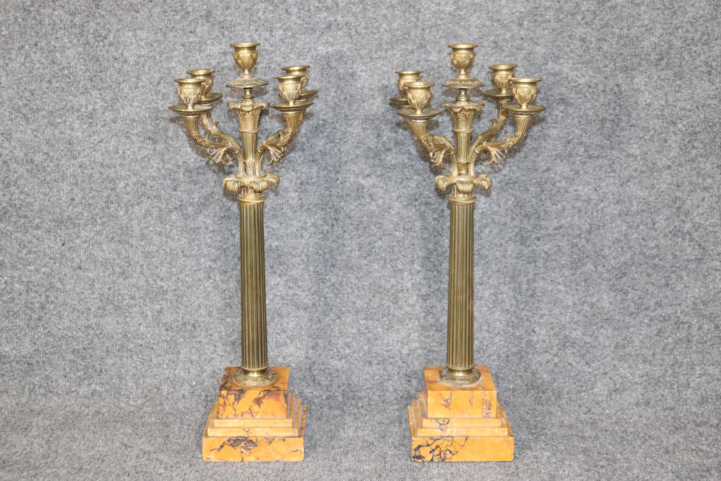 Dimensions: H: 20 1/2in W: 6 3/4in D: 6 3/4in

This beautiful pair of French Empire style 5 light candelabras on marble bases are made from the highest quality bronze. The craftsmanship of these candelabras are breath taking! If you look closely,