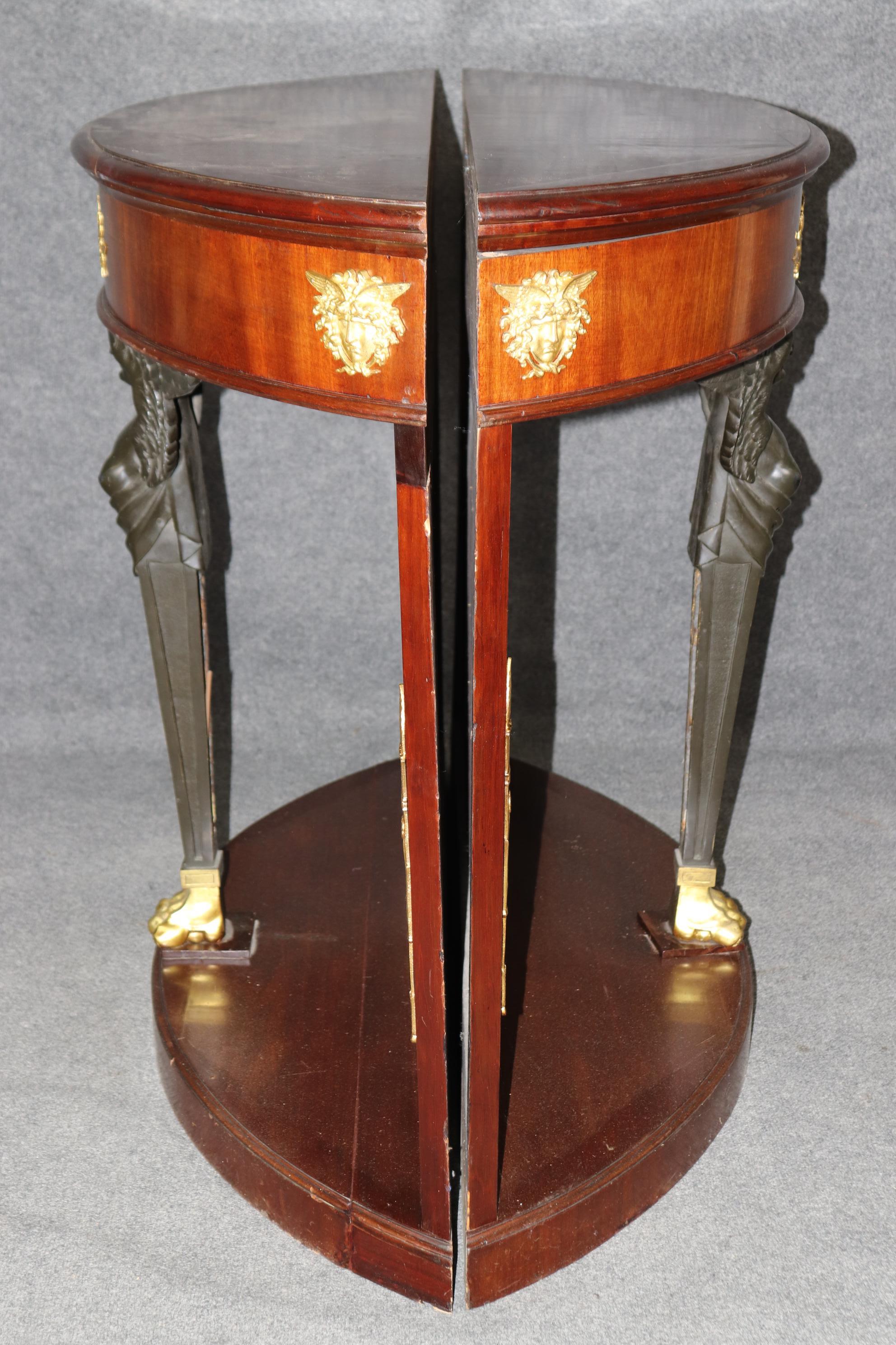 Dimensions - H: 40 1/2in W: 50 1/2in D: 14 1/2in 

This is an EXCEPTIONAL Pair of French Empire Style Consoles! They are made of the highest quality! Made out of the Finest Mahogany and accompanied by Ormolu bronze mounts! The Winged Female in the