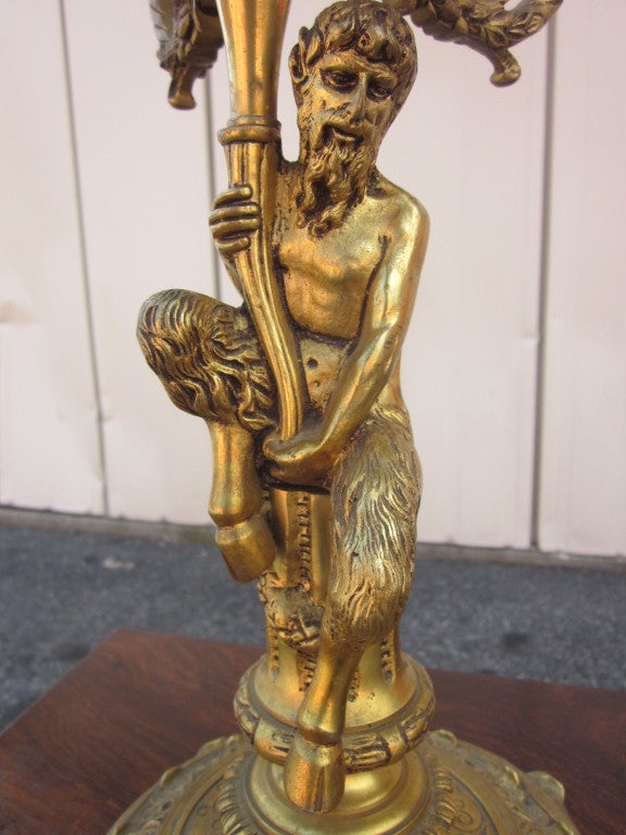 Stunning pair of bronze candelabras with a male figural base.