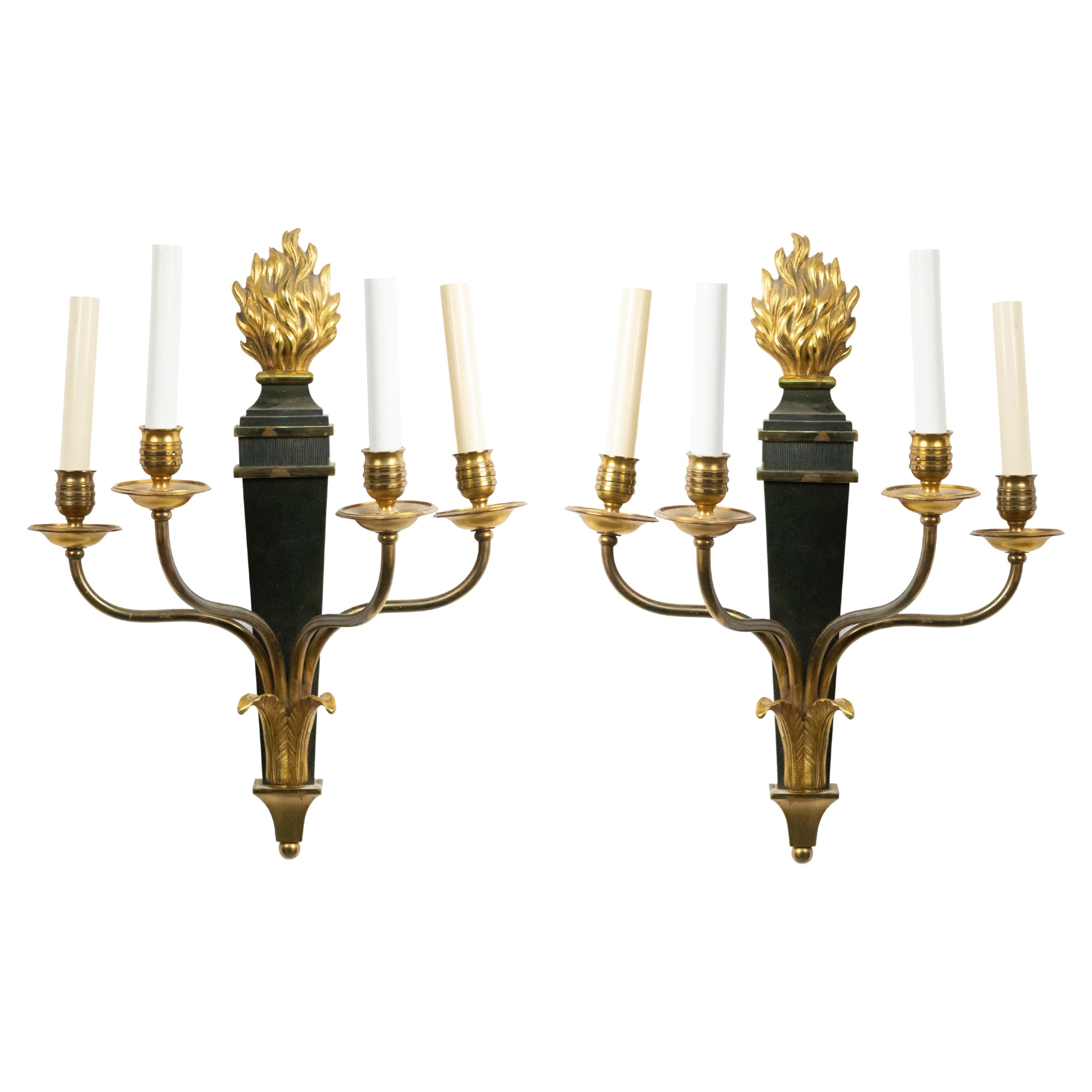 Pair of French Empire Style Ebonized and Gilt Four-Arm Wall Sconces
