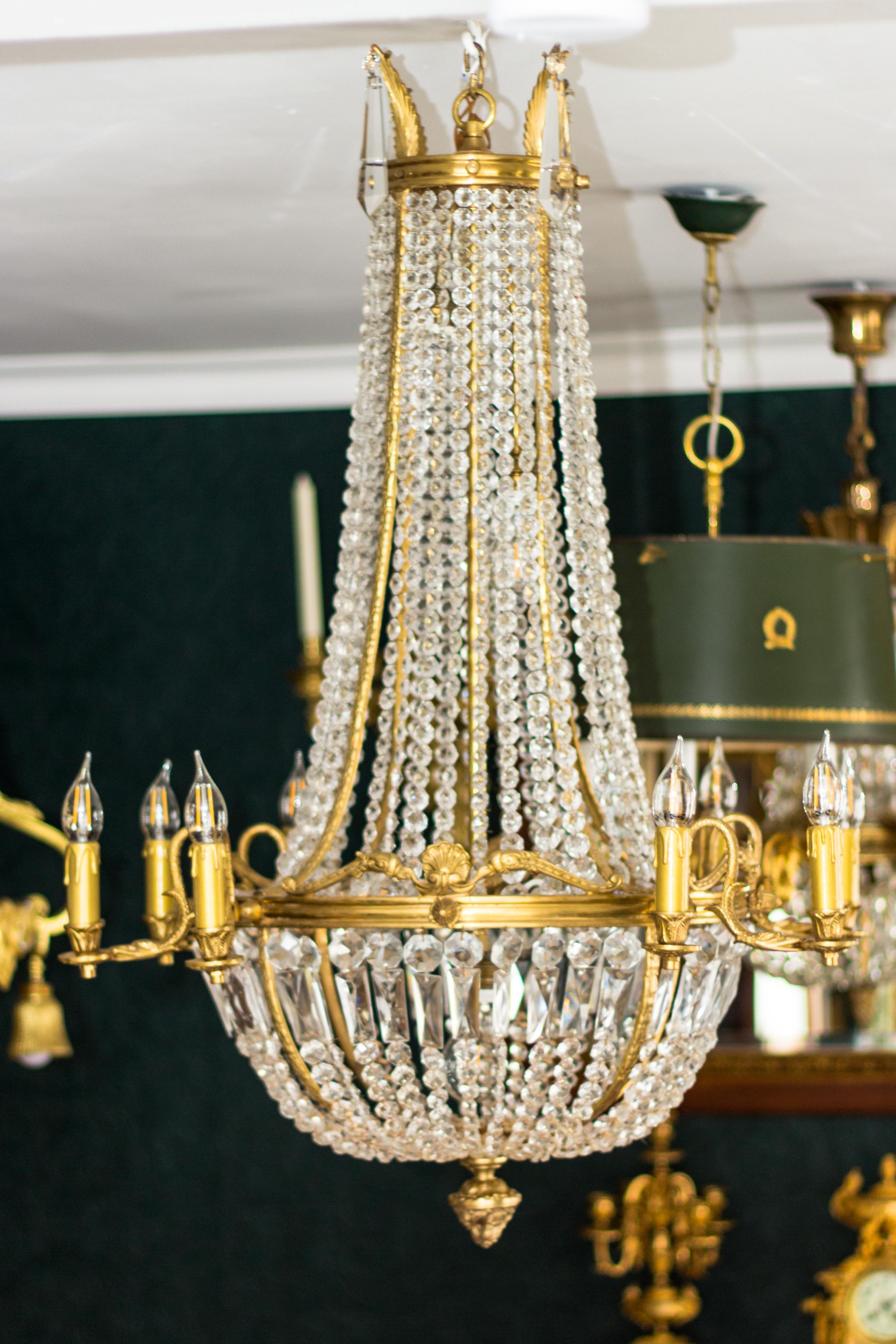 Early 20th Century Pair of French Empire Style Fifteen-Light Crystal and Bronze Basket Chandeliers