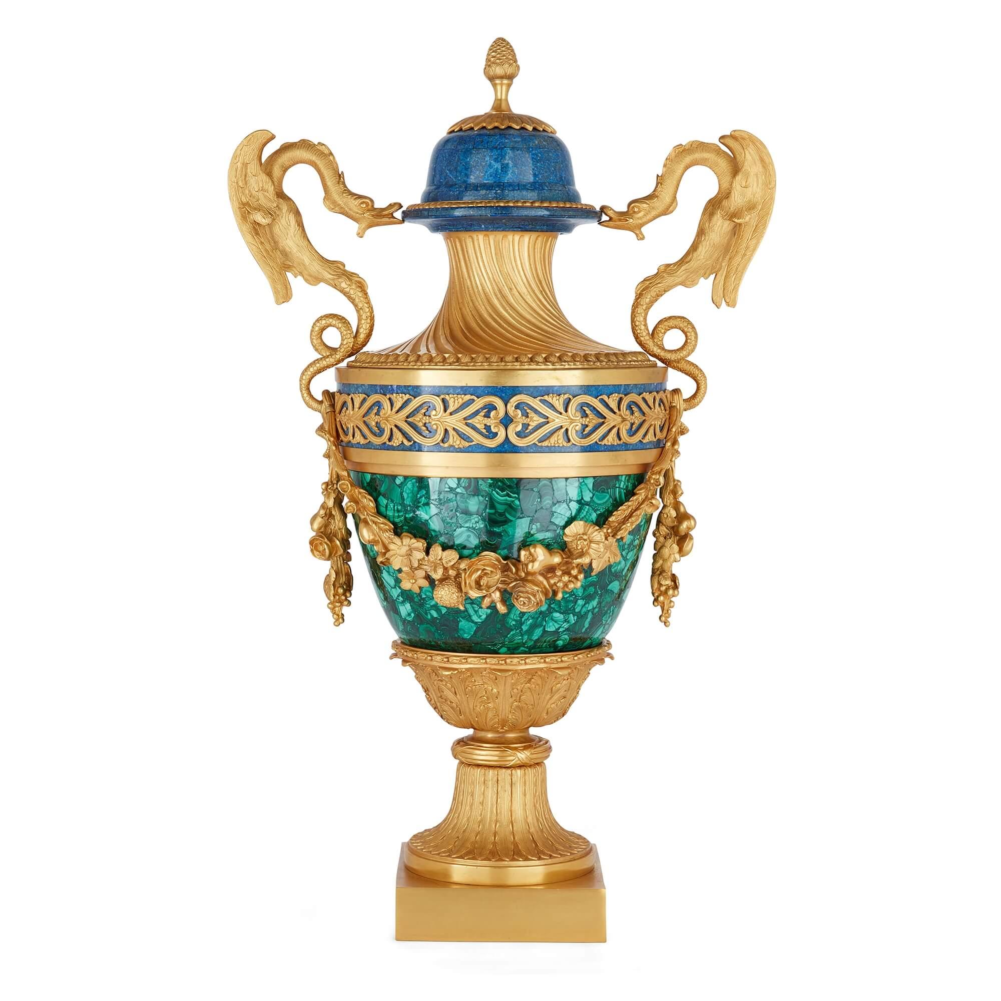 Pair of French Empire style malachite, lapis lazuli and ormolu vases
French, 20th Century
Height 78cm, width 47cm, depth 30cm

Skilfully crafted by French craftsmen, the unusual mixture of materials used for these vases makes them a very desirable