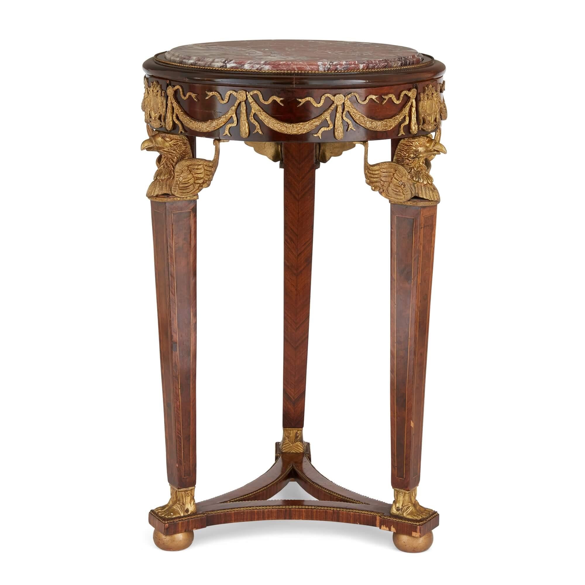 Pair of French Empire style ormolu, wood and marble pedestals 
French, 20th Century 
Height 83cm, diameter 52cm 

This superb pair of French 20th century pedestals celebrates the very refined and elegant Empire style.  

Each pedestal is mounted