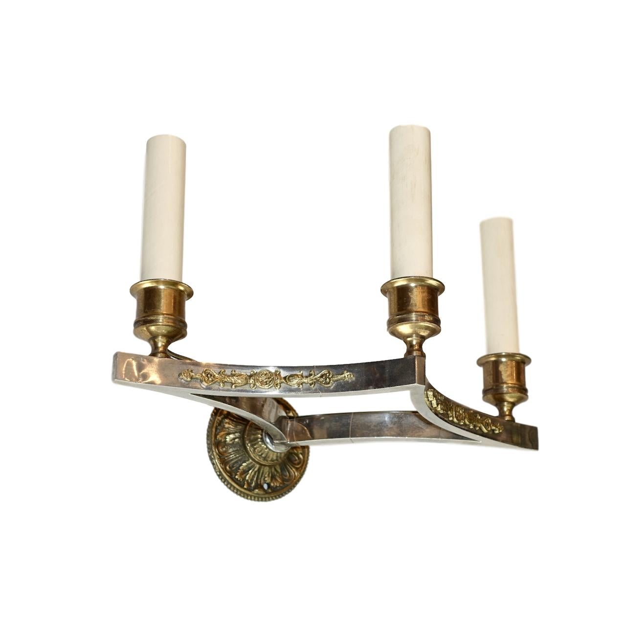 A pair of circa 1940s French Empire sconces with gilt details and backplate.

Measurements:
Height 8