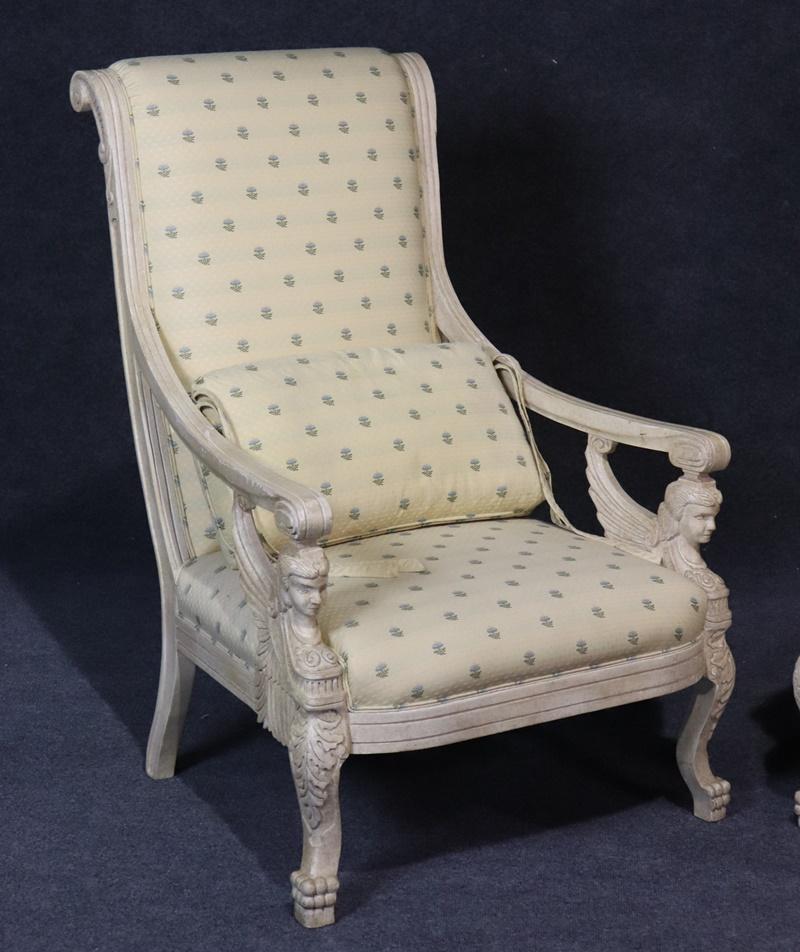 Pair of Empire style winged maiden distressed painted armchairs with matching accent pillows.