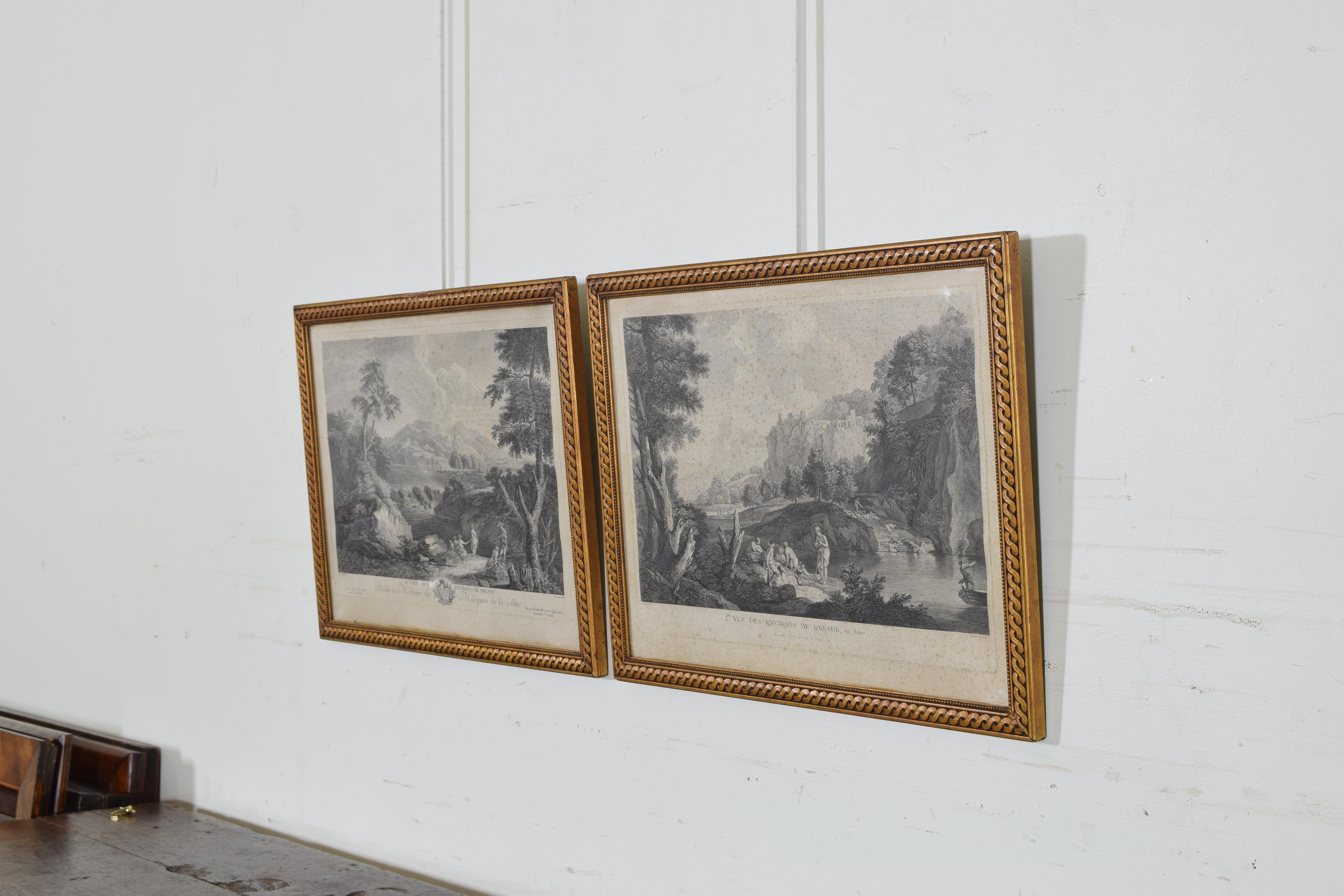 Each depicting bucolic scenes and enclosed in molded and gilded gesso frames.