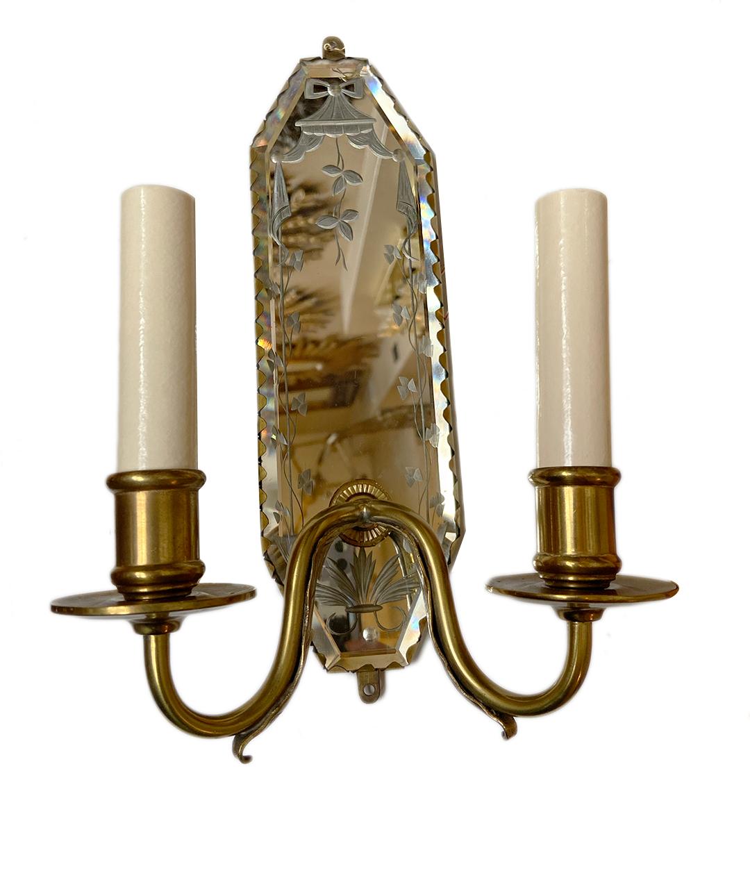 Pair of French circa 1920s two-arm gilt bronze etched mirror sconces.

Measurements:
Height 11.25