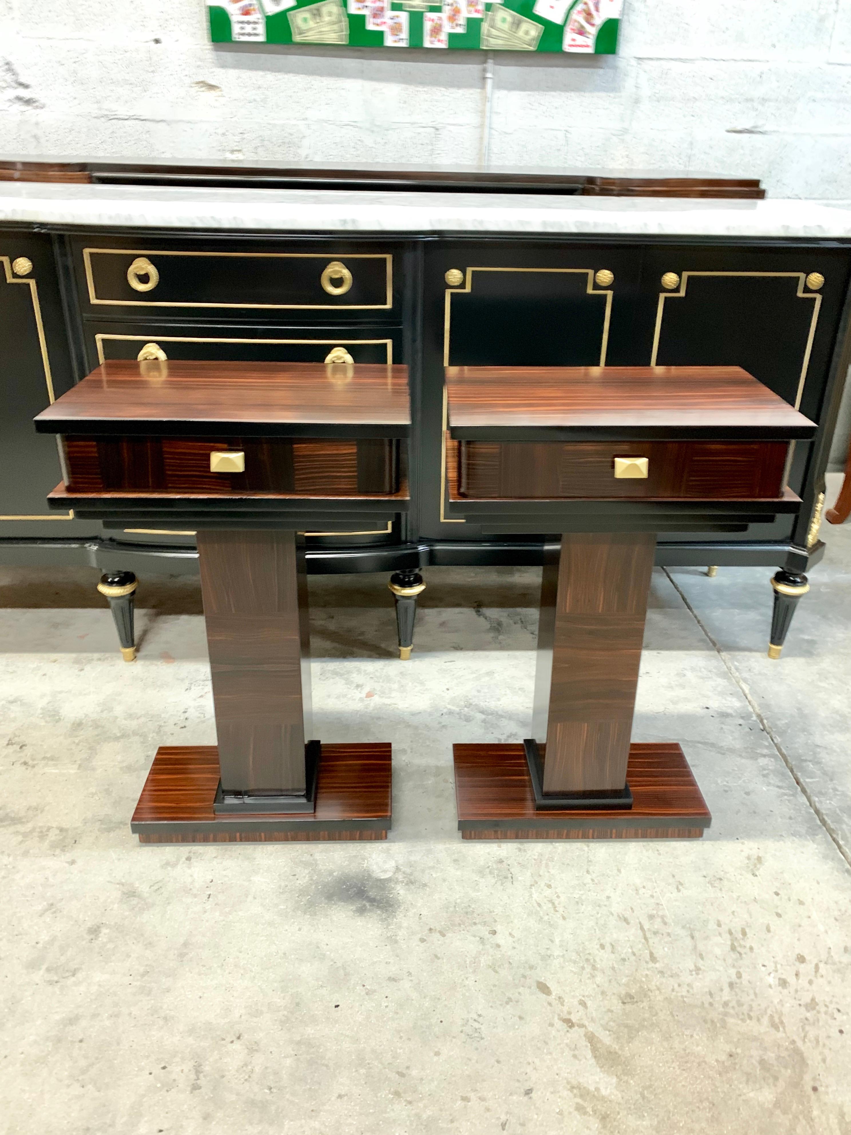 Beautiful pair of French exotic Macassar ebony nightstand or side tables, 1940s, Made of Macassar the Macassar wood has been finished with a French polished, the table a one drawers, that rest on makes it ideal next to a chair or for use as a