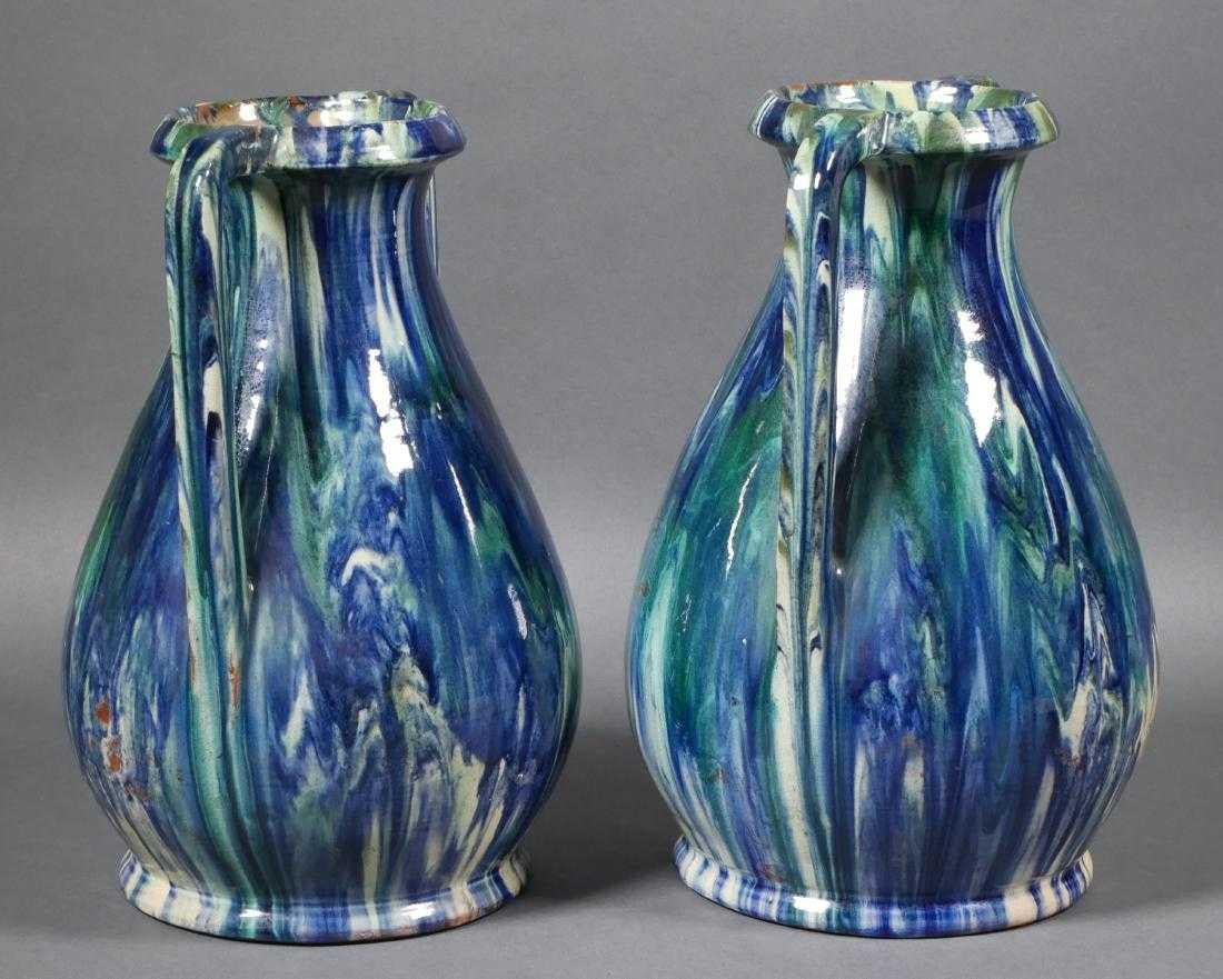 Pair of attractive French Faïence vases with double handles and exquisite Flambé glaze. Signed on base.

 